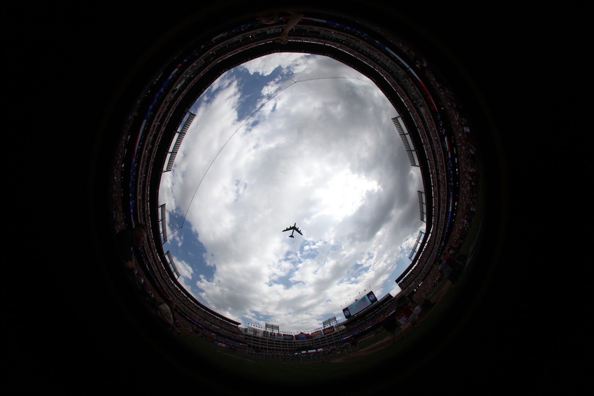 A B-52H Stratofortress bomber crew from the 2d Bomb Wing at Barksdale Air Force Base, La., performs a flyover for the Texas Rangers' opening day baseball game at The Ballpark in Arlington April 1. Air Force aerial events keep the public and military informed of U.S. preparedness, demonstrate modern weapons systems, promote good community and international relations, support Air Force recruiting and retention efforts and render military honors. Air Force Global Strike Command assets are scheduled to provide flyovers for a number of aerial events and air shows this year, including the Indy 500 and the Coca-Cola 600 May 29. Flyovers are incorporated into regularly scheduled training missions and serve as an additional training opportunity for air crews, with precise time on target execution, and other training scenarios incorporated into the events. (Courtesy Photo/Texas Rangers)