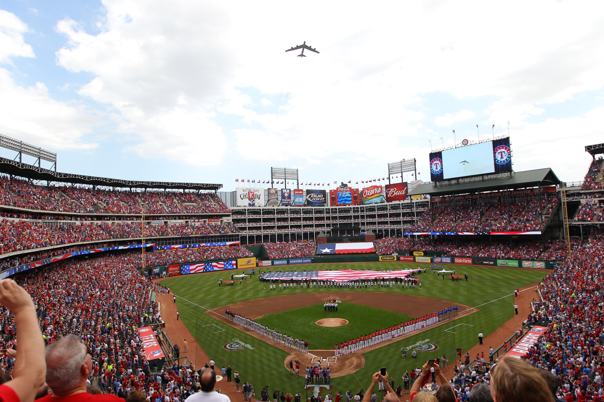 A B-52H Stratofortress bomber crew from the 2d Bomb Wing at Barksdale Air Force Base, La., performs a flyover for the Texas Rangers' opening day baseball game at The Ballpark in Arlington April 1. Air Force aerial events keep the public and military informed of U.S. preparedness, demonstrate modern weapons systems, promote good community and international relations, support Air Force recruiting and retention efforts and render military honors. Air Force Global Strike Command assets are scheduled to provide flyovers for a number of aerial events and air shows this year, including the Indy 500 and the Coca-Cola 600 May 29. Flyovers are incorporated into regularly scheduled training missions and serve as an additional training opportunity for air crews, with precise time on target execution, and other training scenarios incorporated into the events. (Courtesy Photo/Texas Rangers)