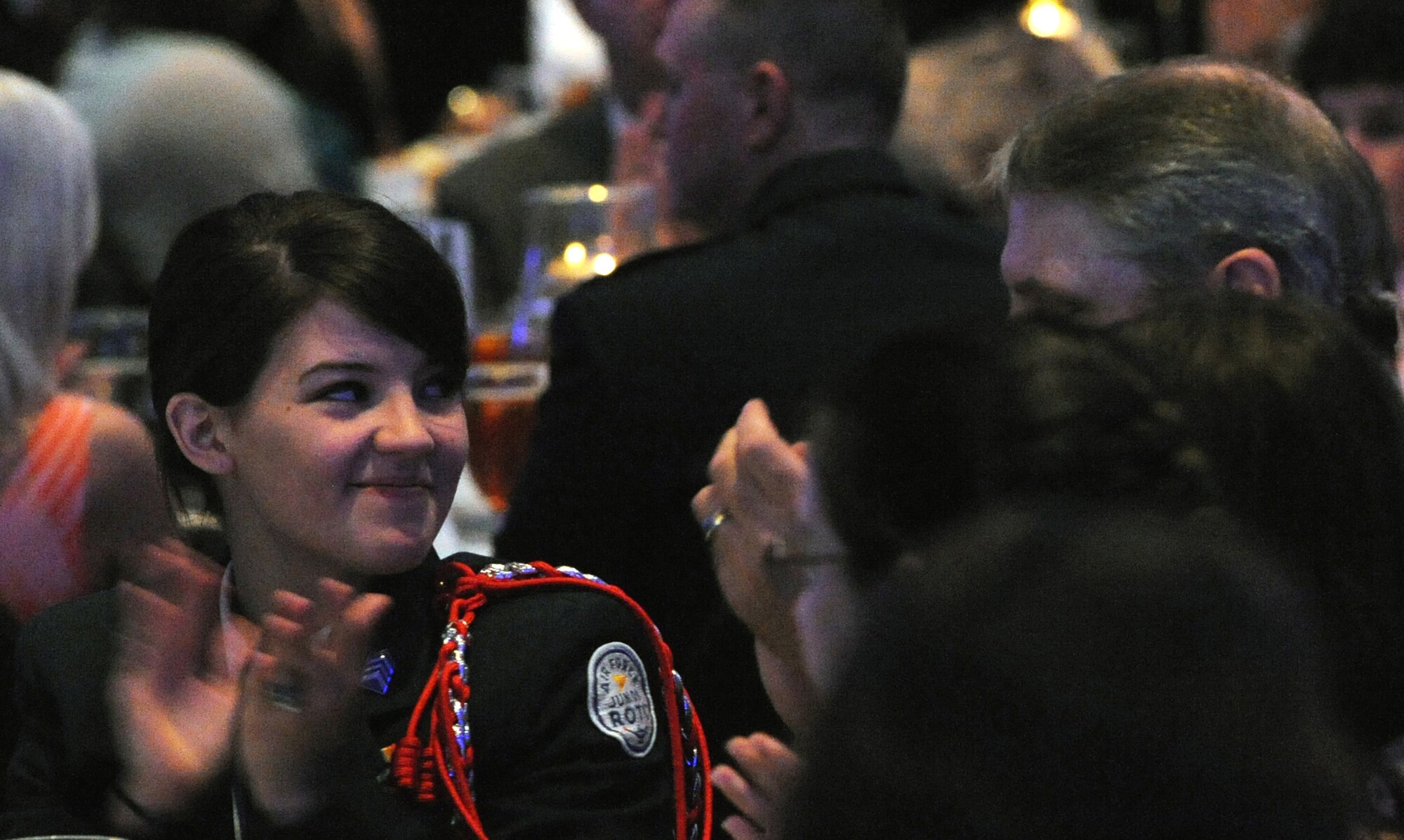 Winner of the AFCEA General Dynamics Diamond Partner scholarship, Ms. Sylvia Lemley, applauds at the Armed Forces Communications and Electronics Association Ark-La-Tex Chapter Scholarship Awards Ceremony at Sam’s Town Casino in Shreveport, La., April 21.  Ms. Lemley is one of ten local area high school students who were presented scholarships to continue education at the university level in math, science or technology.  The commander of Air Force Global Strike Command, Lt. Gen. Jim Kowalski, served as guest speaker. (U.S. Air Force photo/Airman 1st Class Micaiah Anthony)