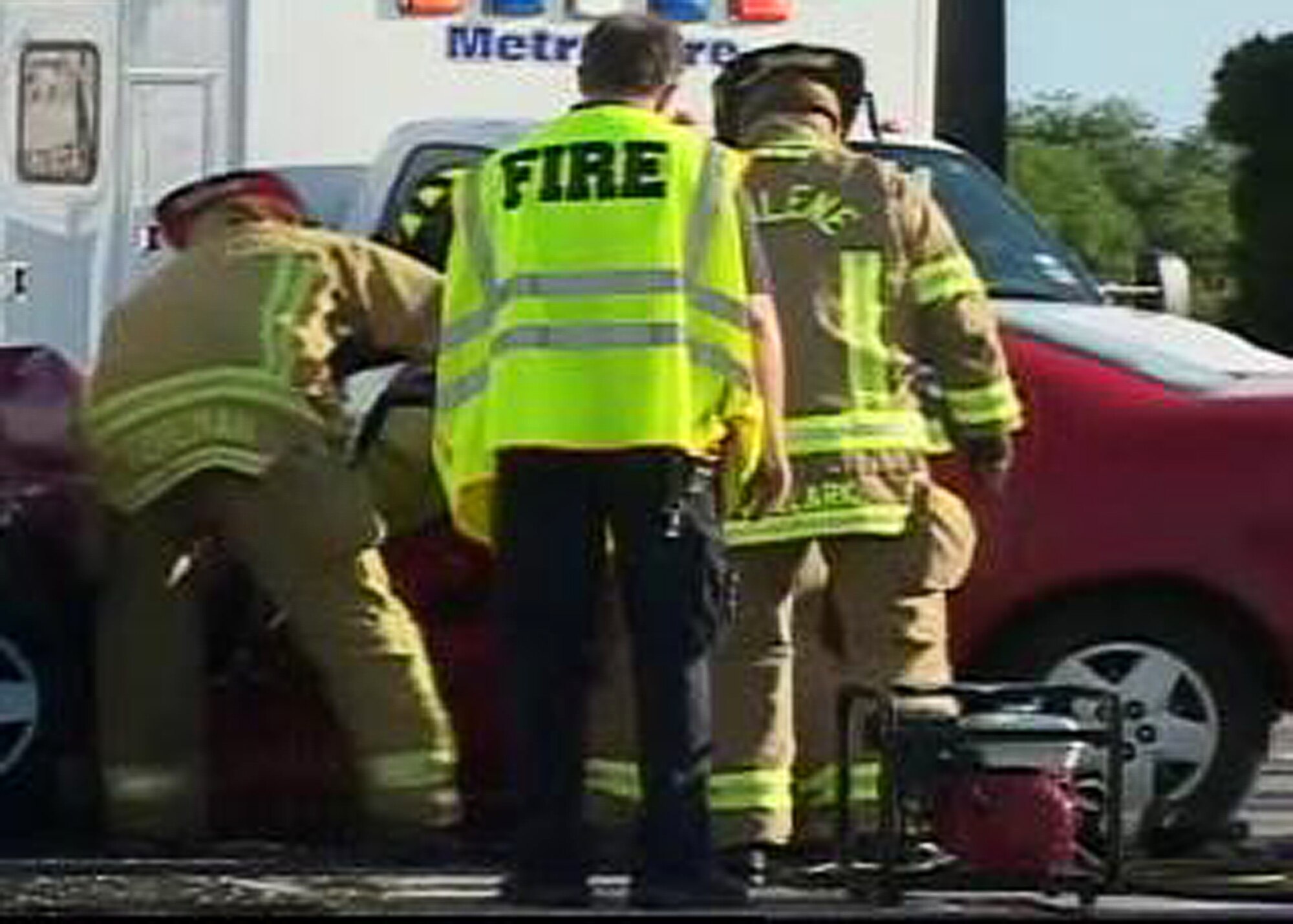 BUCKLEY AIR FORCE BASE, Colo. --Firemen use the Jaws of Life to free Lt. Col. Kelly Kanapaux's daughter from her crushed vehicle, May 25, 2009. A suspected drunk driver crashed almost head-on with his daughter's vehicle when the driver turned into oncoming traffic. (Photo courtesy of Lt. Col. Kelly Kanapaux)
