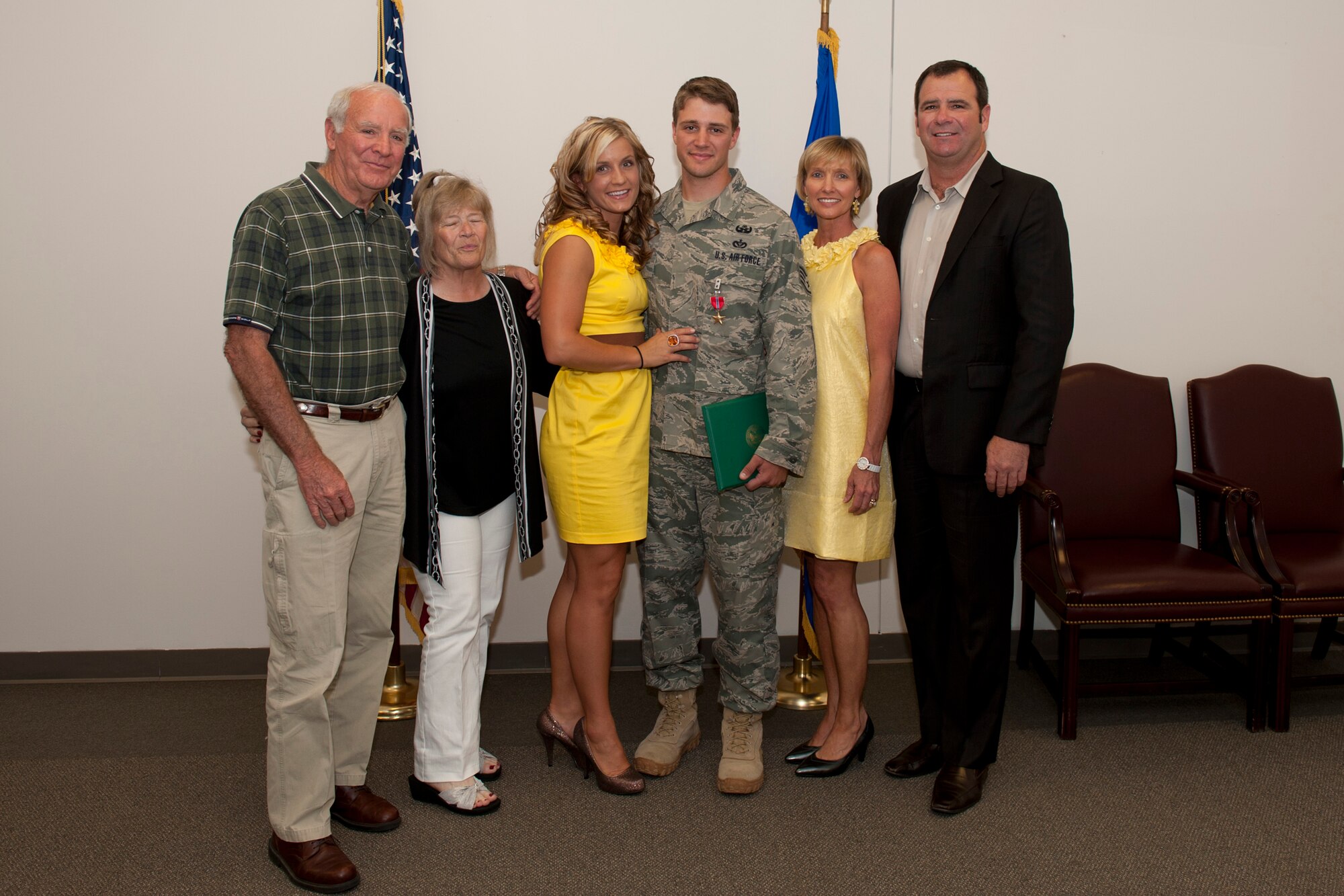 Staff Sgt. Dallas Bozeman, 23rd Civil Engineer Squadron explosive ordnance disposal craftsman, poses for a photo with his grandparents, Furman and Joyce, wife, Kimberly, and parents, Dallas and Marcia, after receiving a Bronze Star Medal April 22 at Moody Air Force Base, Ga. Sergeant Bozeman’s grandparents traveled nine hours from Columbus, Miss., and his parents traveled 17 hours from Katy, Texas, to attend the presentation. (U.S. Air Force photo/Staff Sgt. Jamal D. Sutter)(RELEASED)