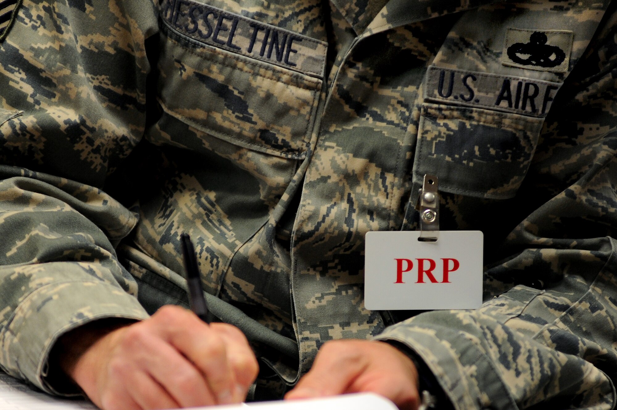 WHITEMAN AIR FORCE BASE, Mo. - A Personal Reliability Program Airman fills out paperwork at the clinic here April 18. PRP ensures those who work with critical components here are in top working condition to provide safe, secure and effective handling of the nuclear enterprise. (U.S. Air Force photo by Senior Airman Kenny Holston)