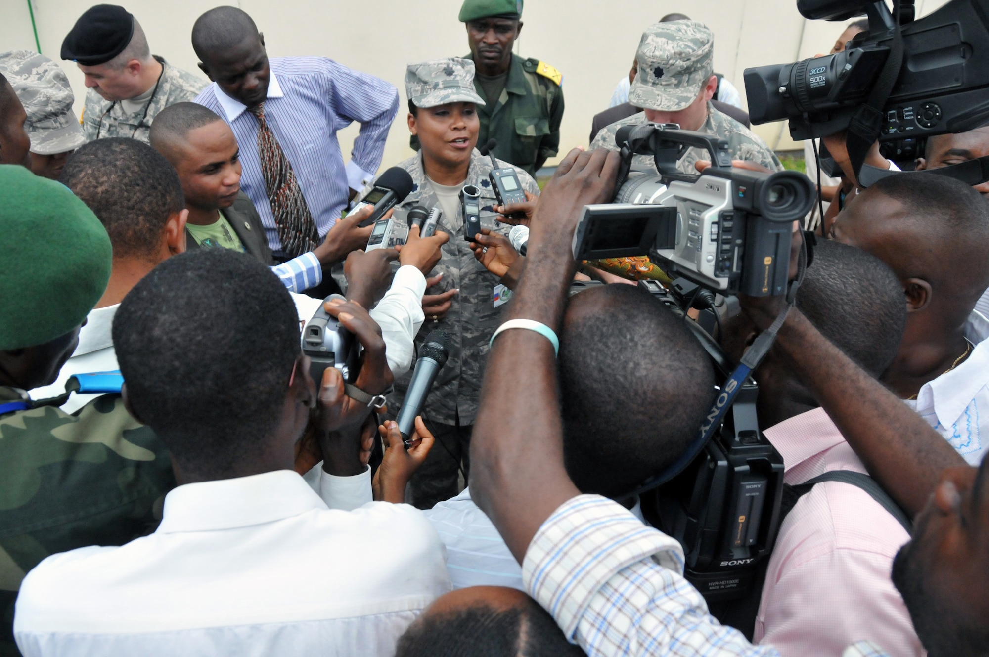 Lt. Col. June Oldman speaks with members of the local media after the opening ceremony April 25, 2011, in Kinshasa, Democratic Republic of the Congo. MEDLITE 11 is a joint medical exercise focused on aeromedical evacuation, to improve the readiness of U.S. Air Force and DRC personnel.Colonle Oldman is the mission director for MEDLITE 11. (U.S. Air Force photo/1st Lt. Adam Gregory) 