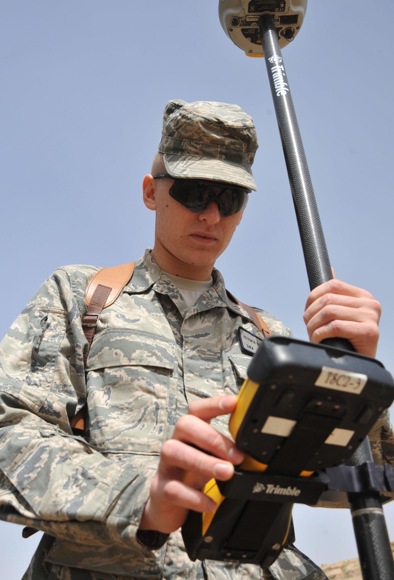 Senior Airman Yevgeniy Shatrovskiy, a Facilities Engineer Team engineering assistant, uses site surveying equipment, April 13, 2011, at Contingency Operating Site Marez, Iraq. The Marez team produces statements of work, plans and specifications for projects as well as surveying and mapping for several bases across northern Iraq. Airman Shatrovskiy is a Congers, N.Y., native and is deployed from Dover Air Force Base, Del. (U.S. Air Force Photo/Senior Airman Andrew Lee)