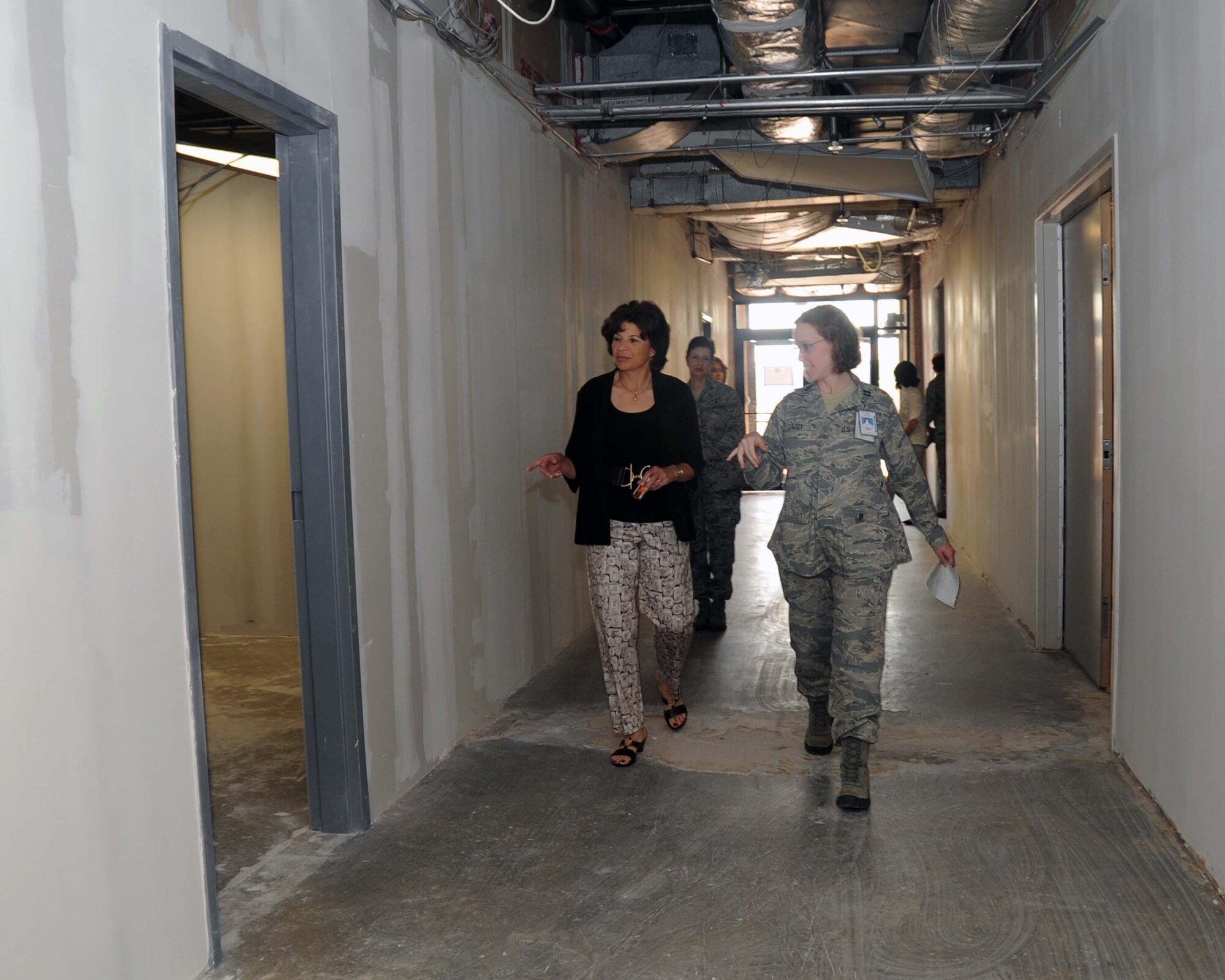 ALTUS AIR FORCE BASE, Okla.—Capt. Courtney Addy, 97th Medical Group Resource Management/ Tricare operations and patient administration flight commander, gives Mrs. Teresa Rice, wife of Air Education and Training Command Commander Gen. Edward A. Rice Jr., a tour of the current and completed construction projects in the 97th MDG clinic. The tour included the new optometry and radiology clinics. (U.S. Air Force photo/Senior Airman Leandra D. Stepp)