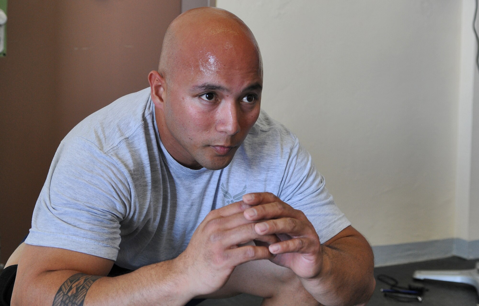 SPANGDAHLEM AIR BASE, Germany – Staff Sgt. Charles Cruz, 52nd Communications Squadron ground radio technician, performs squats during a pledge drive at the Combat Fitness Center to raise money for sexual assault victims in the Eifel here April 25. Thirty-two people attended the event and raised approximately $600 by performing 348 rounds of exercises equaling 1,760 pull-ups, 3,500 push-ups, and 5,220 squats. The money will be used to provide food, clothing and lodging to sexual assault victims in the Eifel region. (U.S. Air Force photo/Senior Airman Nick Wilson)