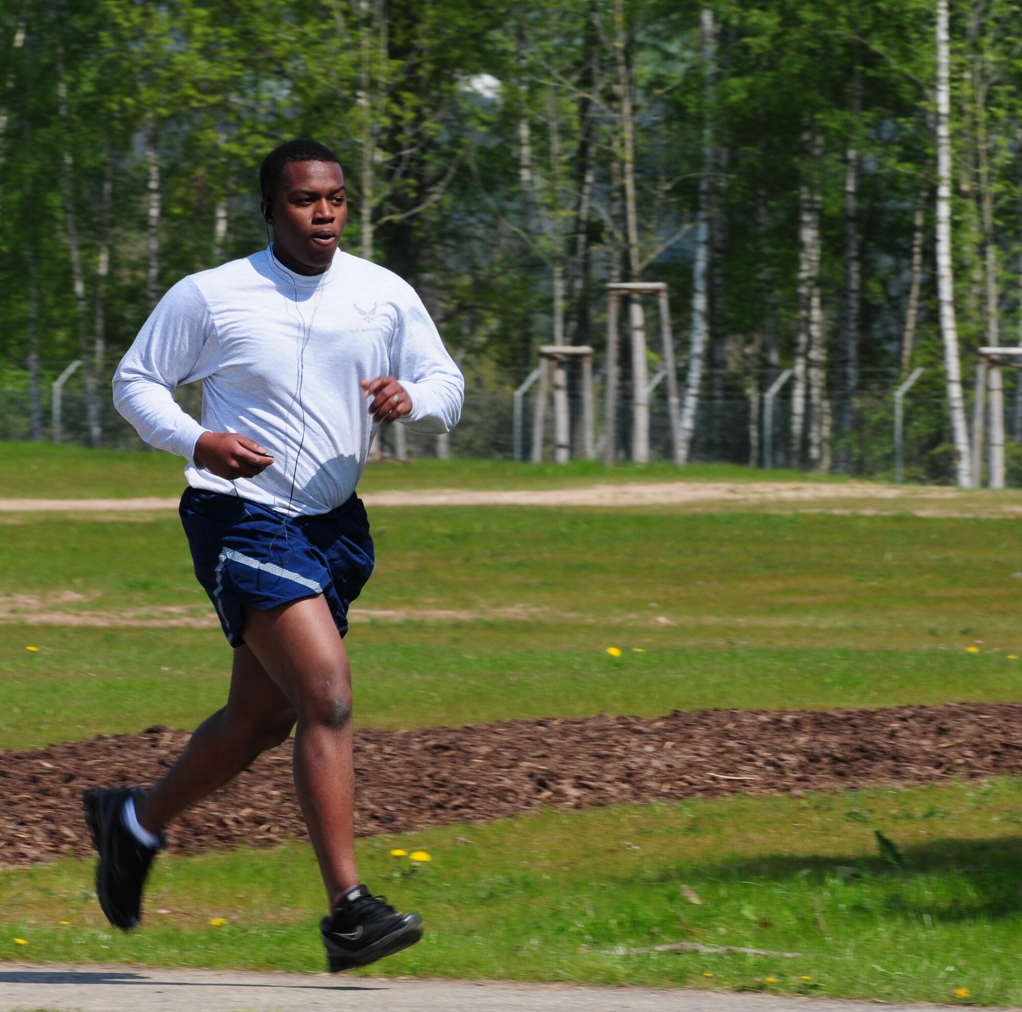 SPANGDAHLEM AIR BASE, Germany — Senior Airman Nick Wilson, 52nd Fighter Wing Public Affairs, runs down Perimeter Road during 5k run here April 20. The run was held to promote sexual assault awareness and Earth Day Awareness among Airmen and families. (U.S. Air Force photo/Airman 1st Class Dillon Davis)