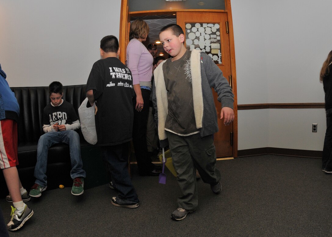 Members of the 914th and 107th Airlift Wings and their families participate in the Children's Easter Egg Hunt at the Niagara Falls Air Reserve Station Falcon Club, April 23, 2010, Niagara Falls NY. The egg hunt was held inside the Falcon Club where candy filled plastic eggs were hidden for the children to find. (U.S. Air Force photo by Staff Sgt. Joseph McKee)