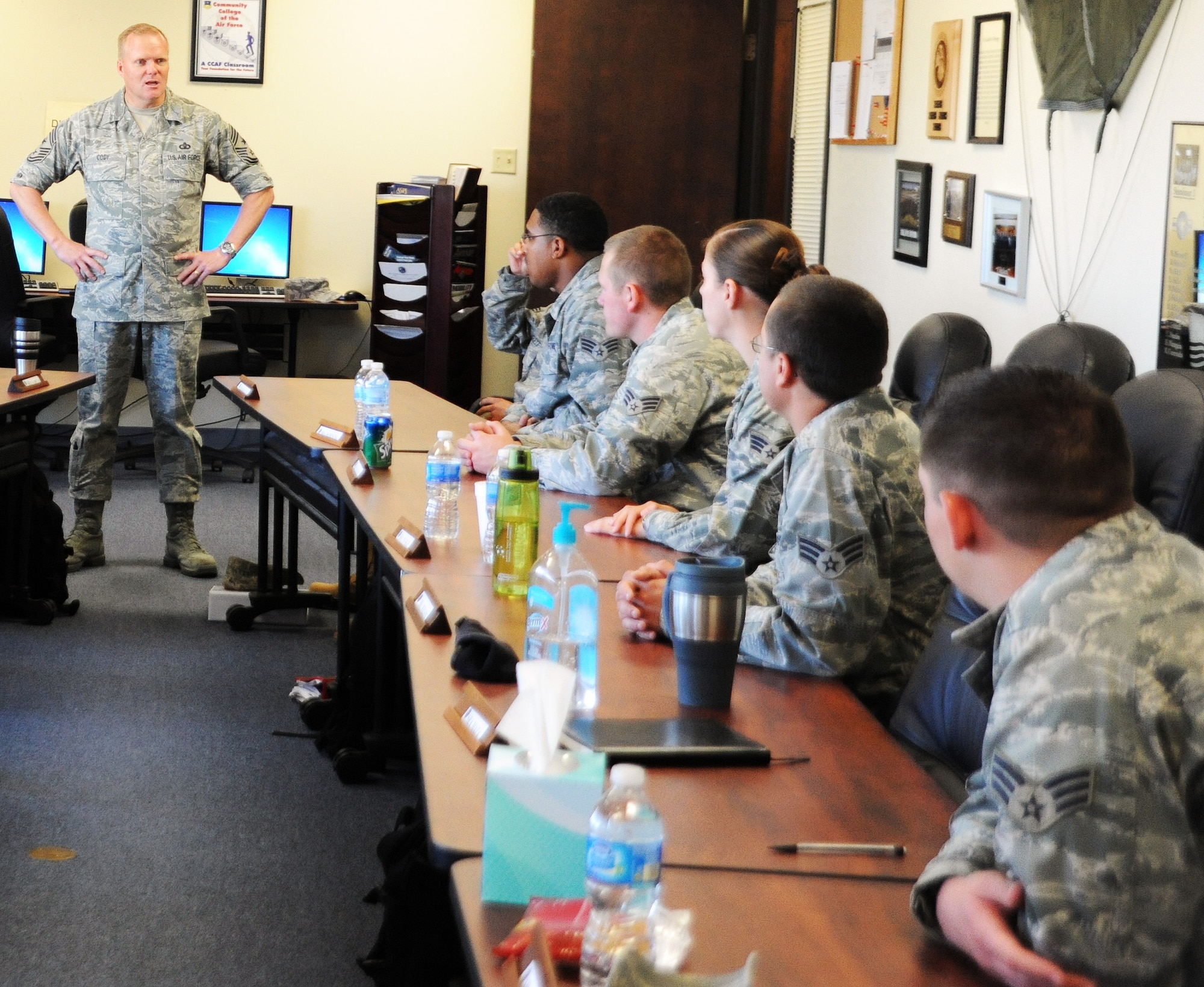 ALTUS AIR FORCE BASE, Okla. -- Chief Master Sgt. James Cody, command chief of Air Education and Training Command, speaks to students in Airman Leadership School April 22. Chief Cody visited different sections of the base and spoke with Airmen from across the wing about their jobs to learn what goes on during the Mighty 97th's day-to-day operations. (U.S. Air Force photo by Airman 1st Class Kenneth W. Norman/ 97th Air Mobility Wing Public Affairs)