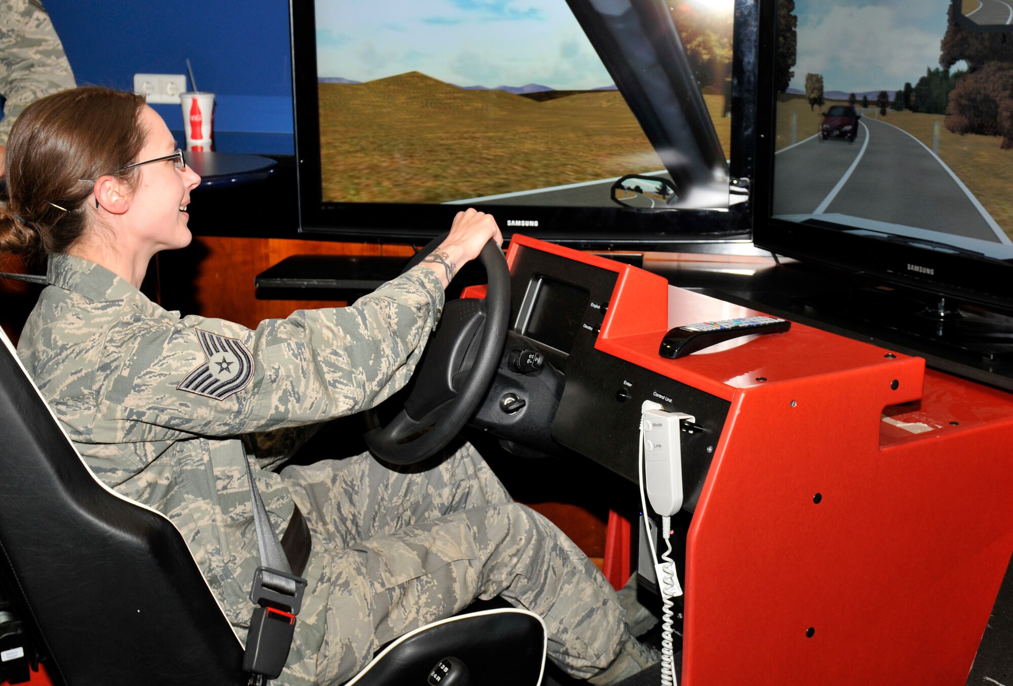 SPANGDAHLEM AIR BASE, Germany – Tech. Sgt. Holly Williams, 52nd Fighter Wing Inspector General, drives a drunken driving simulator as part of a 52nd FW Safety demonstration during the Operation Odyssey Dawn Bash here April 22. The event was hosted to thank service members and their families for all their hard work and support during Operation Odyssey Dawn. (U.S. Air Force photo/Airman 1st Class Brittney Frees)