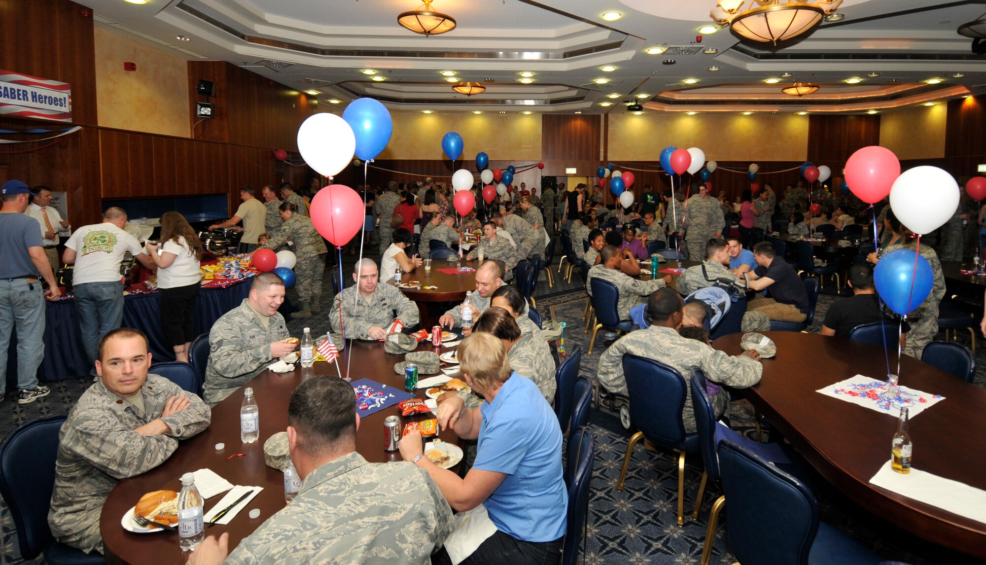 SPANGDAHLEM AIR BASE, Germany – Airmen enjoy free food and drink during the Operation Odyssey Dawn Bash here April 22. The event was hosted to thank service members and their families for all their hard work and support during Operation Odyssey Dawn. (U.S. Air Force photo/Airman 1st Class Brittney Frees)