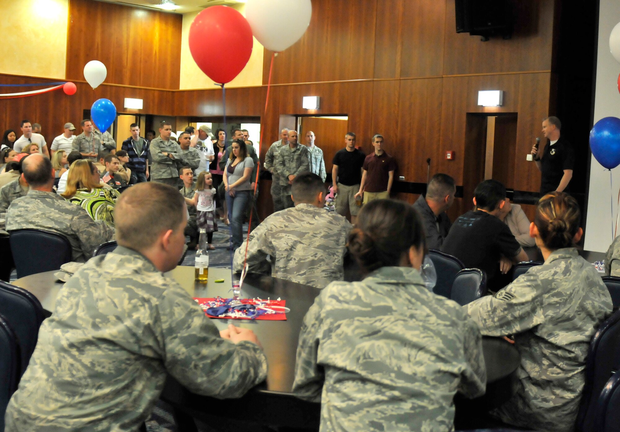 SPANGDAHLEM AIR BASE, Germany – Col. Christopher Weggeman, 52nd Fighter Wing commander, addresses the crowd during the Operation Odyssey Dawn Bash here April 22. The event was hosted to thank service members and their families for all their hard work and support during Operation Odyssey Dawn. (U.S. Air Force photo/Airman 1st Class Brittney Frees)