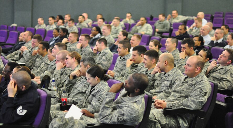 A group of Airmen laugh during a performance of the show, "Sex Signals" at Osan's base theater April 25. "Sex Signals" presents a series of various dating scenes performed by professional actors who bring realistic circumstances to life and allow Airmen to learn about sexual assault in a "lively and humorous" way. In some cases talking about very serious subject matter. (U.S. Air Force photo/Staff Sgt. Chad Thompson)