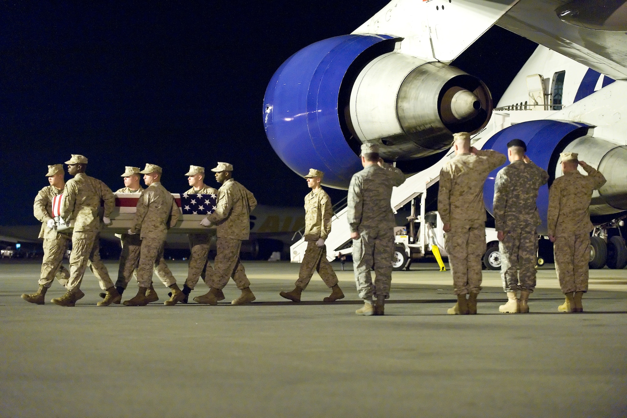 A U.S. Marine Corps carry team transfers the remains of Marine Sgt. Sean T. Callahan, of Warrenton, Va., at Dover Air Force Base, Del., April 25, 2011. Callahan was assigned to the 3rd Battalion, 9th Marine Regiment, 2nd Marine Division, II Marine Expeditionary Force, Camp Lejeune, N.C. (U.S. Air Force photo/Roland Balik)