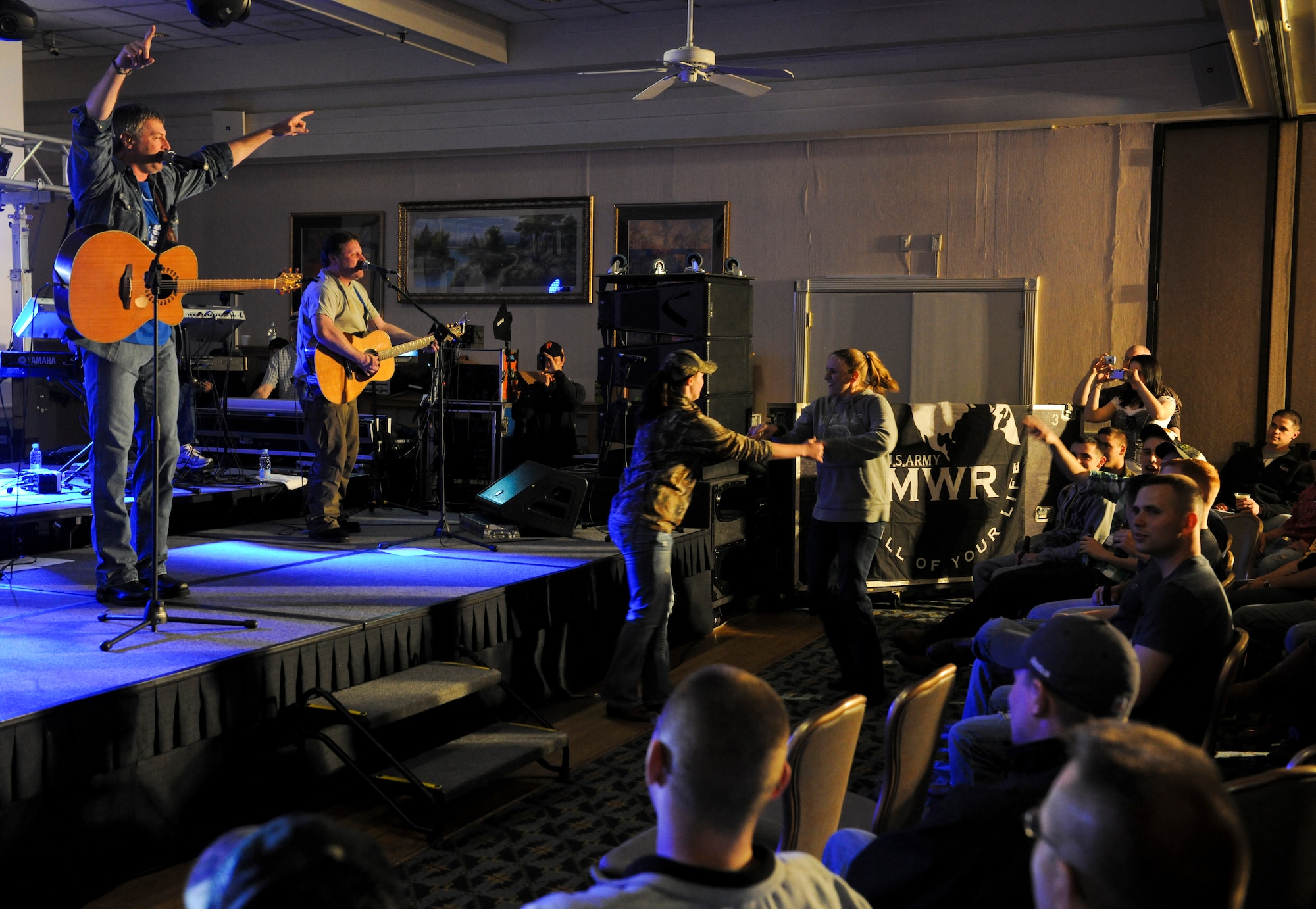 KUNSAN AIR BASE, Republic of Korea -- Darryl Worley, a U.S. country singer, plays for a crowd of more than 250 Wolf Pack Airmen at the Loring Club here April 23. Mr. Worley visited to show his appreciation for everything Kunsan does to ensure he and his family stays safe. (U.S. Air Force photo/Senior Airman Benjamin Stratton)