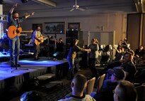 KUNSAN AIR BASE, Republic of Korea -- Darryl Worley, a U.S. country singer, plays for a crowd of more than 250 Wolf Pack Airmen at the Loring Club here April 23. Mr. Worley visited to show his appreciation for everything Kunsan does to ensure he and his family stays safe. (U.S. Air Force photo/Senior Airman Benjamin Stratton)