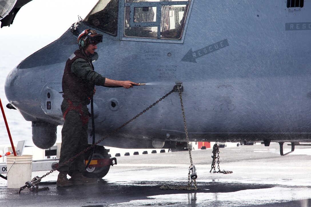 Corporal Daniel S. Porrocecchio, an MV-22B Osprey mechanic with Marine Medium Tilt Rotor Squadron 263 (Reinforced), 22nd Marine Expeditionary Unit, and native of South Brunswick, N.J., washes an MV-22B Osprey aboard USS Bataan, April 26, 2011.  Porrocecchio with a team of Marines from VMM-263 (Rein) scrubbed and rinsed the Osprey, removing salt, dirt and other corrosive materials from the aircraft’s surface.  The Marines and sailors of the 22nd MEU are currently deployed with Amphibious Squadron 6 aboard USS Bataan Amphibious Ready Group and will continue to train and improve the MEU’s ability to operate as a cohesive and effective Marine Air Ground Task Force. The 22nd MEU is a multi-mission, capable force, with approximately 2,200 Marines and sailors, and comprised of Aviation Combat Element, Marine Medium Tilt Rotor Squadron 263 (Reinforced); Logistics Combat Element, Combat Logistics Battalion 22; Ground Combat Element, Battalion Landing Team, 2nd Battalion, 2nd Marine Regiment; and its Command Element.