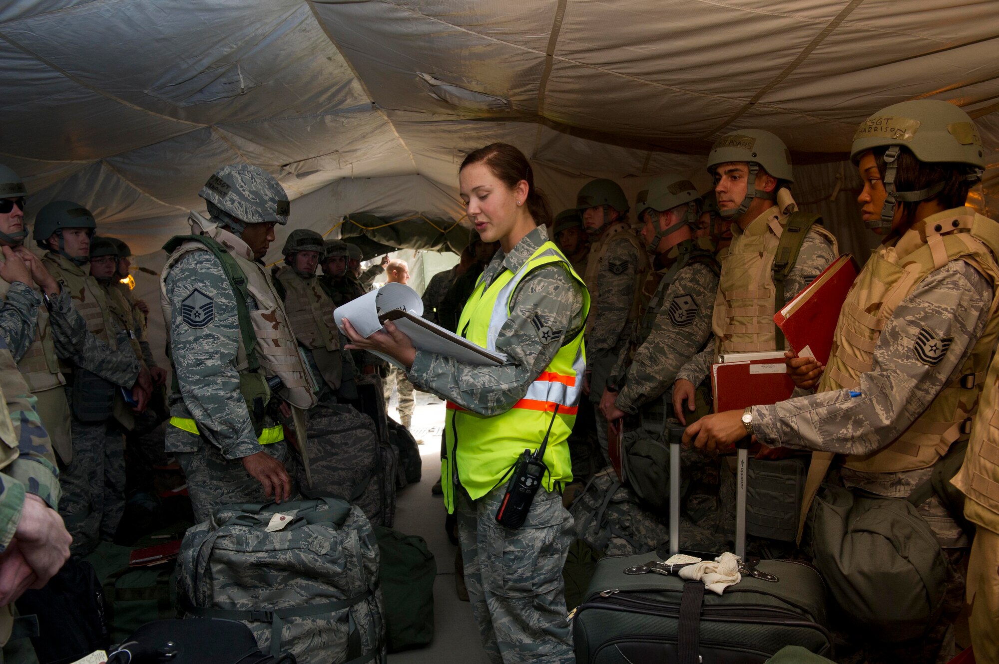 HOLLOMAN AIR FORCE BASE, N.M. -- Airman 1st Class Destinie Ferdig, 49th Logistics Readiness Squadron, briefs personnel for an exercise deployment, April 26, 2011, during the 49th WingÕs Operational Readiness Inspection at the Personnel Deployment Function.  The purpose of an ORI is to show the Air Combat Command Inspector General Team that Team Holloman can quickly transition from peacetime readiness to a wartime posture. (U.S. Air Force photo by Airman 1st Class Eileen Payne/Released)