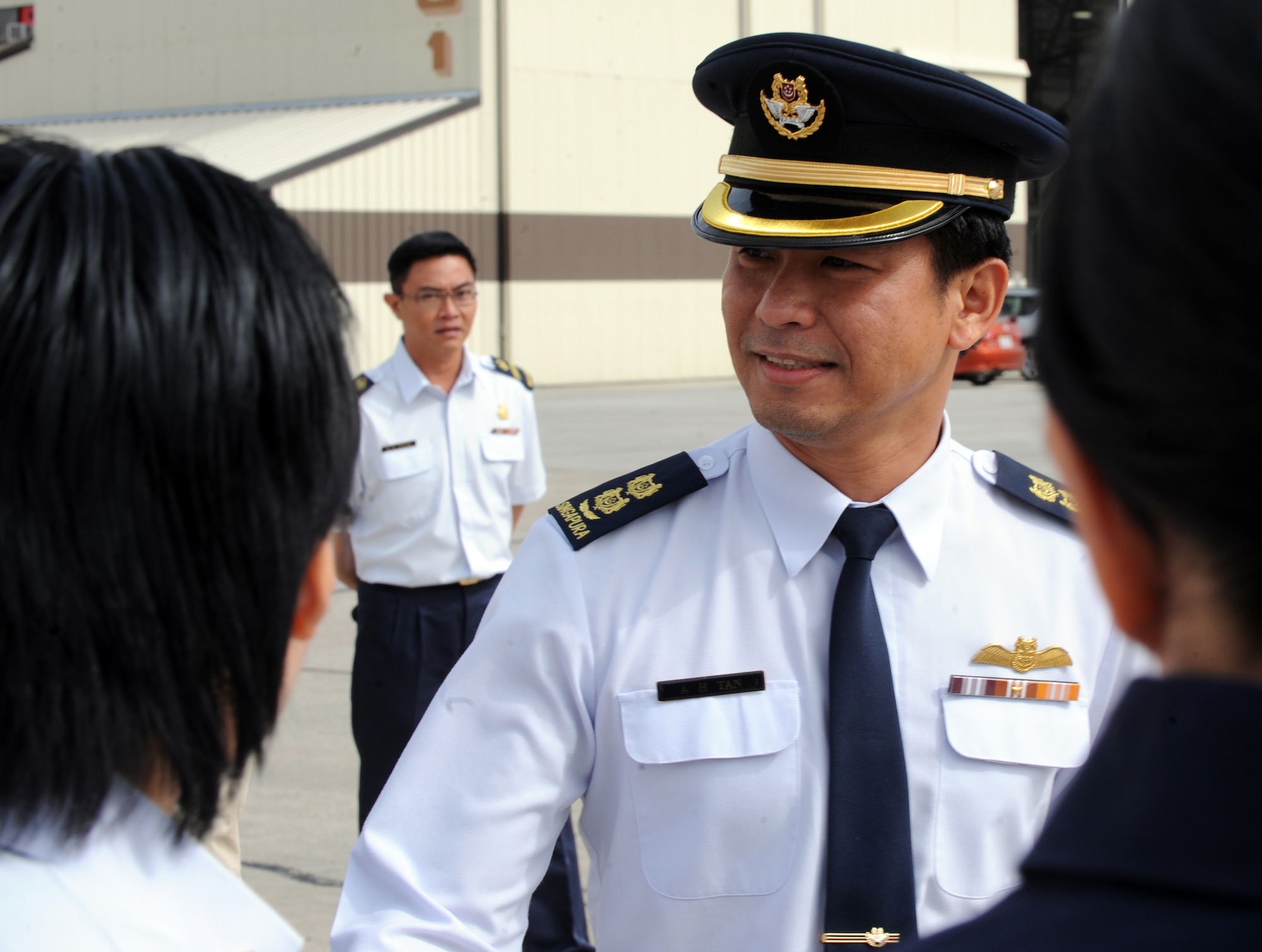 MOUNTAIN HOME AIR FORCE BASE, Idaho – Senior Lt. Col. Tommy Tan says farewell to Airmen assigned to the 428th Fighter Squadron after a Change of Appointment Ceremony held in hangar 1329, April 15. Lt. Col. Linus Tan Jin Kiat assumed the appointment of senior Republic of Singapore air force officer  of the Peave Carvin V detachment. (U.S. Air Force photo by Senior Airman Debbie Lockhart)