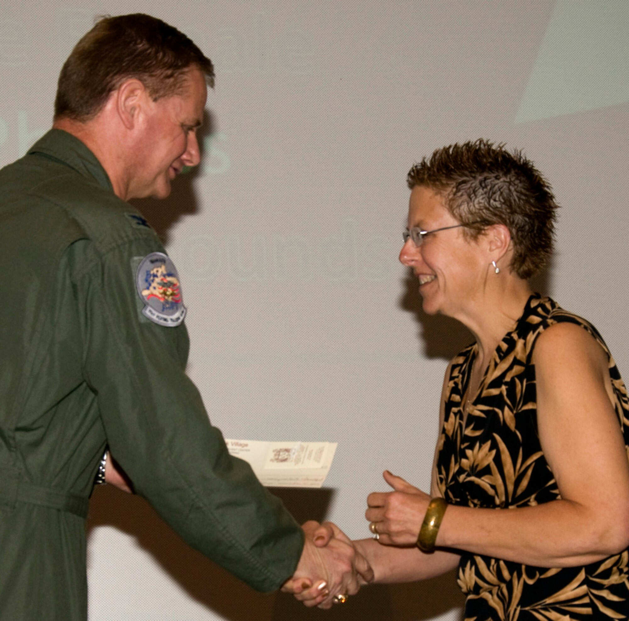 Patty Phillips, right, is congratulated by Col. Russ Mack, the 71st Flying Training Wing commander, during Vance AFB’s 2011 Biggest Loser competition reveal ceremony held April 26. Ms. Phillips earned first place in the female category by dropping 35.6 pounds since the competition began in January. (U.S. Air Force photo/ Roger Betz)