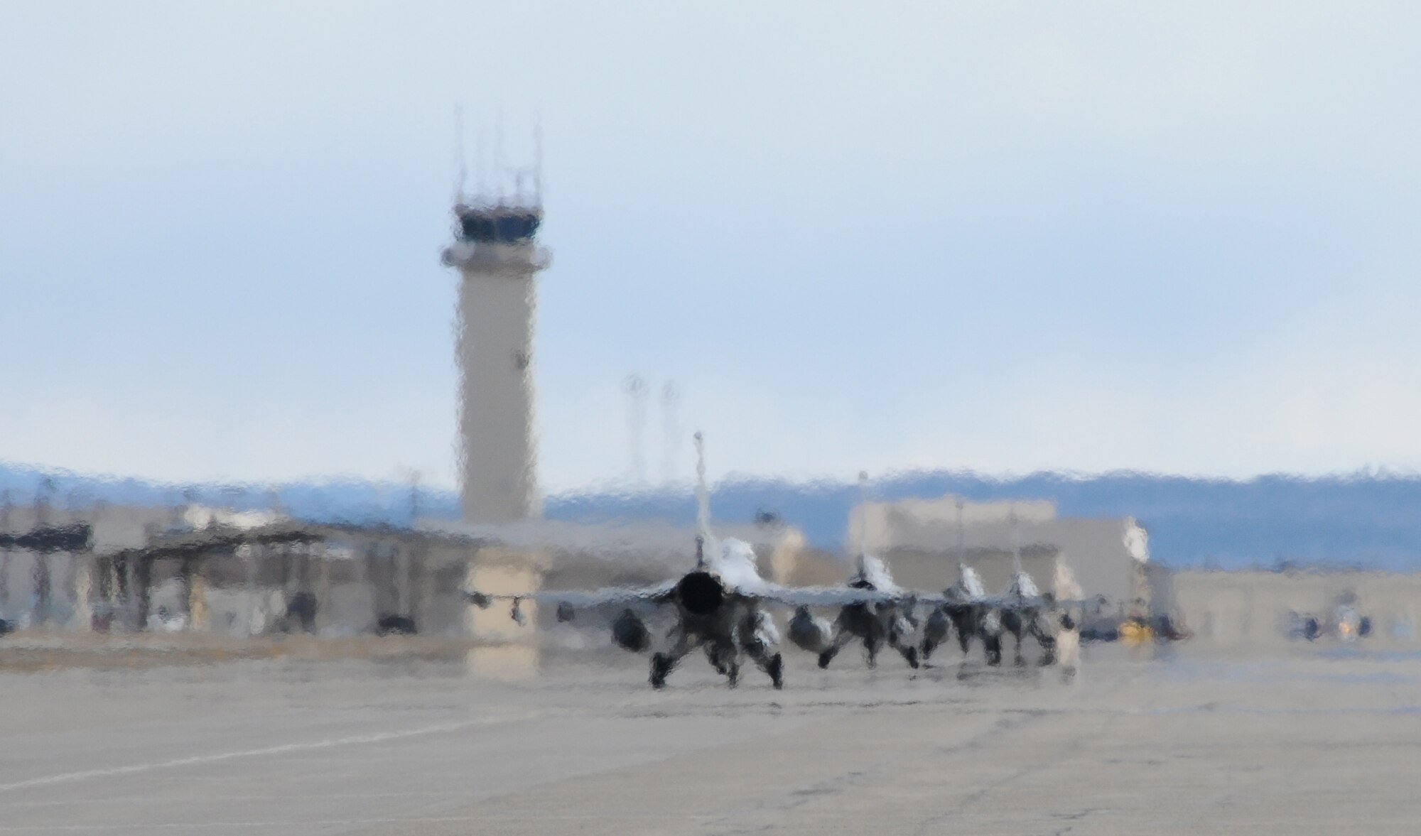 Four F-16 Fighting Falcons taxi the runway during RED FLAG-Alaska 11-1 April 25, 2011, Eielson Air Force Base, Alaska. RF-A allows aircrews to practice large-scale combat missions over 67,000 square miles. The exercises are conducted on the Joint Pacific Alaskan Range Complex with air operations flown out of Eielson and Elmendorf Air Force Bases. The F-16s are from Kunsan Air Base, Korea. (U.S. Air Force photo/Senior Airman Rachelle Coleman)