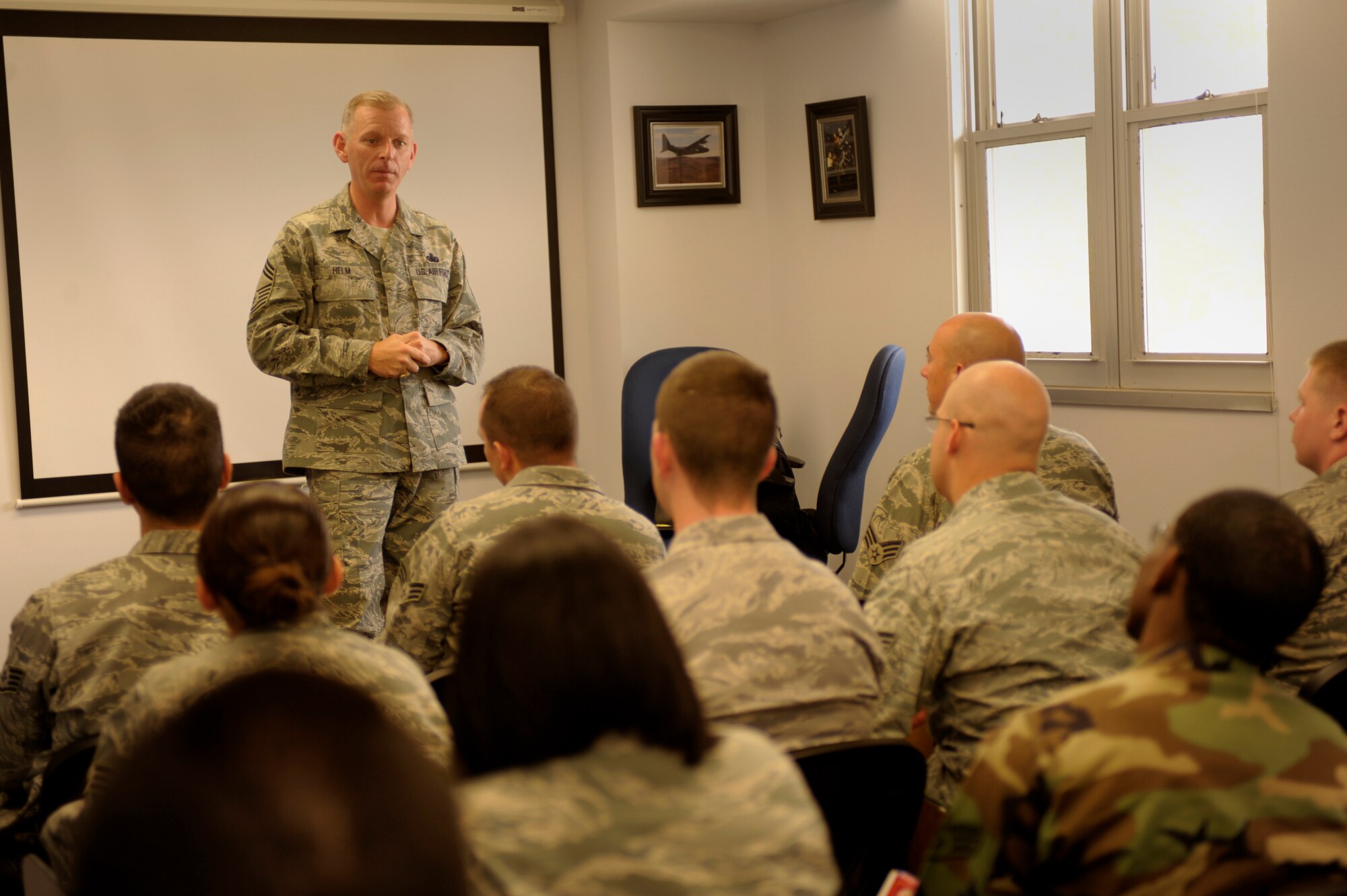 U.S. Air Force Chief Master Sgt. Jeffry D. Helm, Senior Enlisted Leader to the Commanding General, Army and Air Force Exchange Services (AAFES), speaks to the members of Airman Leadership School class 11-E April 26, 2011, about improvements planned for AAFES institutions at Cannon Air Force Base, N.M.  Chief Helm is the focal point for communication between the commander and the 12.2 million servicemembers, veterans and their families that use AAFES facilities. (U.S. Air Force photo by Airman Ericka Engblom) 