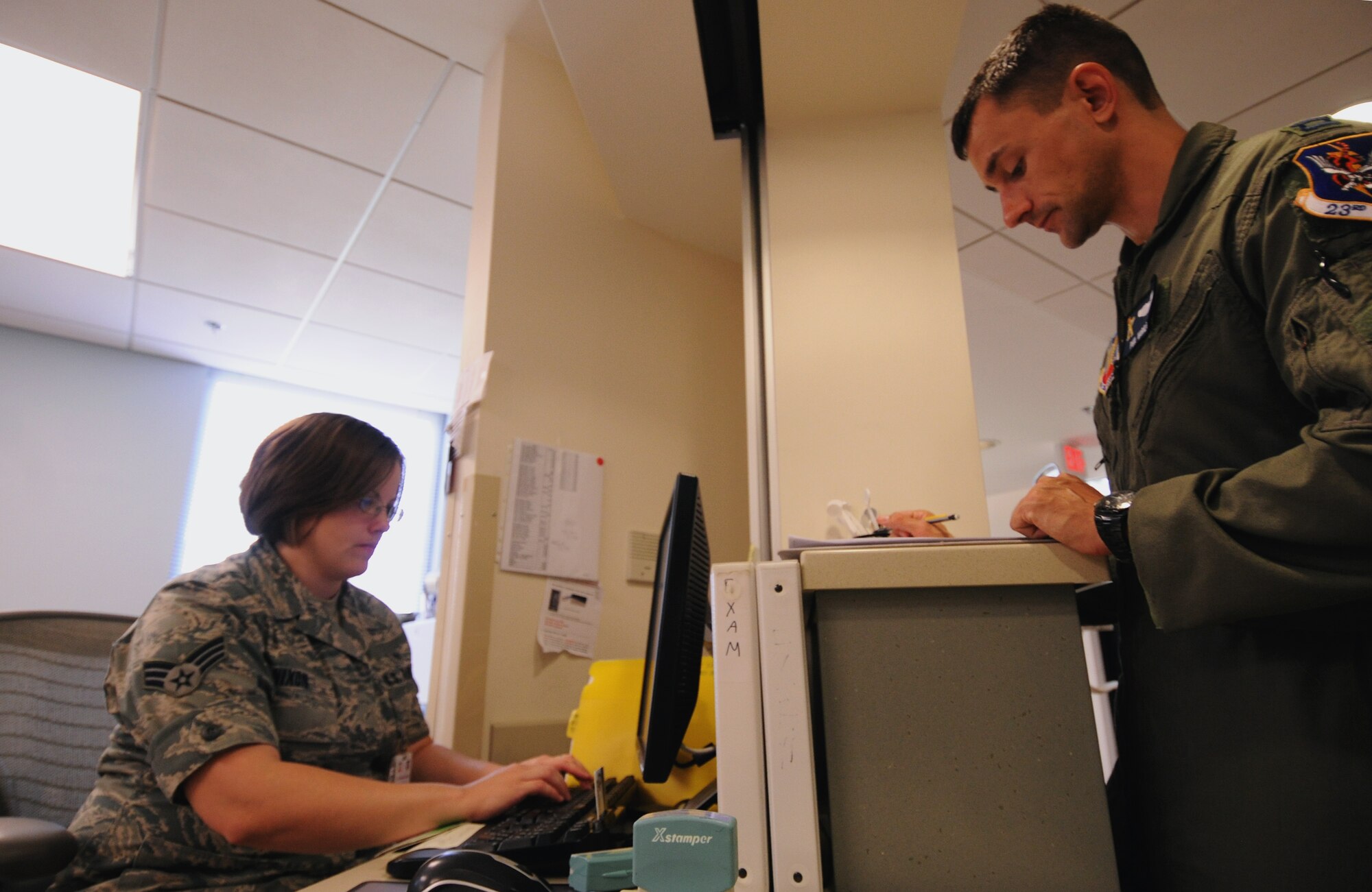 Capt. Phil Varilex, 71st Rescue Squadron, schedules an appointment with Senior Airman Judith Nixon, 23rd Aerospace Medicine Squadron, during a visit to the 23rd Medical Group Dental Clinic at Moody Air Force Base, Ga., April 27. Members of the dental clinic had a few words of wisdom to Moody personnel: “Only floss the teeth you want to keep, and brush every day.” (U.S. Air Force photo/Airman 1st Class Benjamin Wiseman)(RELEASED)
