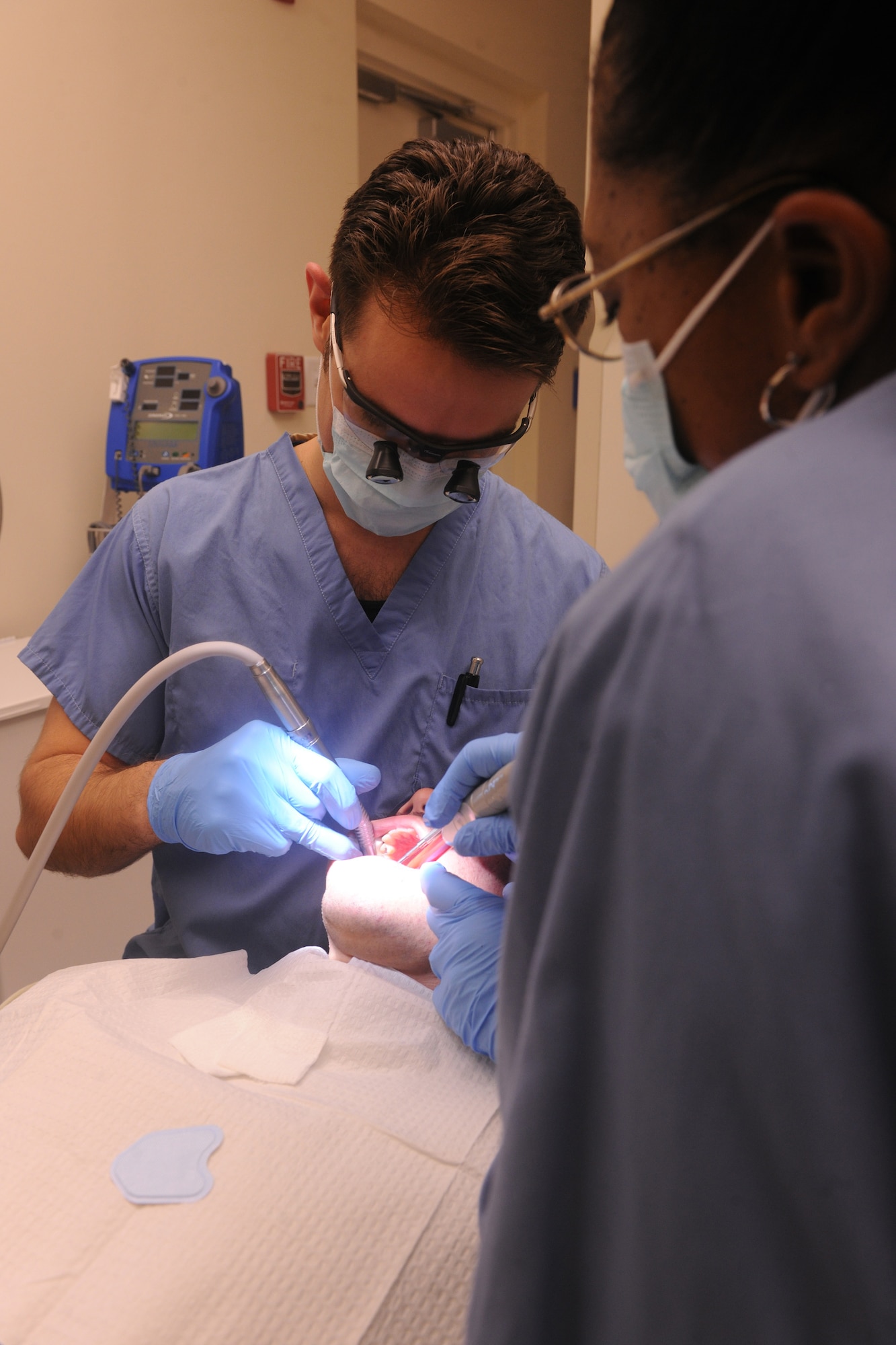 Capt. Stephen Lambert, 23rd Aerospace Medicine Squadron dentist, provides oral care to a patient  at the 23rd Medical Group Dental Clinic at Moody Air Force Base, Ga., April 27. On a daily basis, Captain Lambert will see nearly 15 patients throughout the day. The work the Dental Clinic provides can range from a routine checkup to a root canal and fillings. (U.S. Air Force photo/Airman 1st Class Benjamin Wiseman)(RELEASED) 
