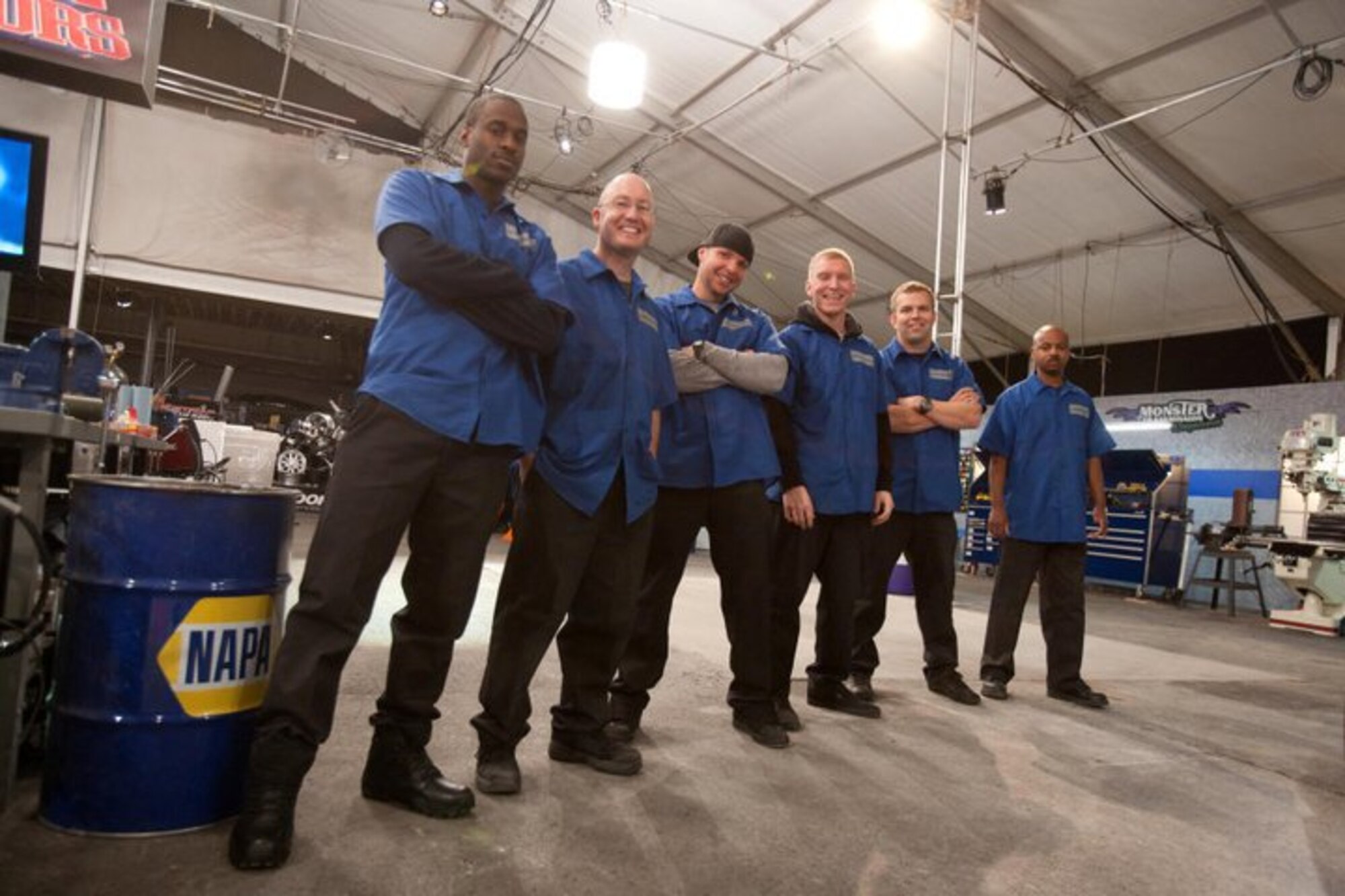 (From left) 2nd Lt. Nick Baker, James Coppi, Senior Airman Travis Barron, Airman 1st Class Andrew Golseth, Maj. Mike Nielsen and Tech Sgt. Justin Woldridge, stand on the set of the Speed Channel's "Car Warriors." The all-Air Force team from Edwards Air Force Base, Calif., competed against the all-star team of show regulars to turn a bare race car into a "NASCAR Death Race Machine." The Airmen chose an Air Force theme and created an "A-10 Thunderbolt II" on four wheels, beating out their competition with a superior car. Missing from the photo are teammates Mike Adams from the 412th Maintenance Group and Staff Sgt. Brad Bove from Moody AFB, Ga. (Courtesy photo)