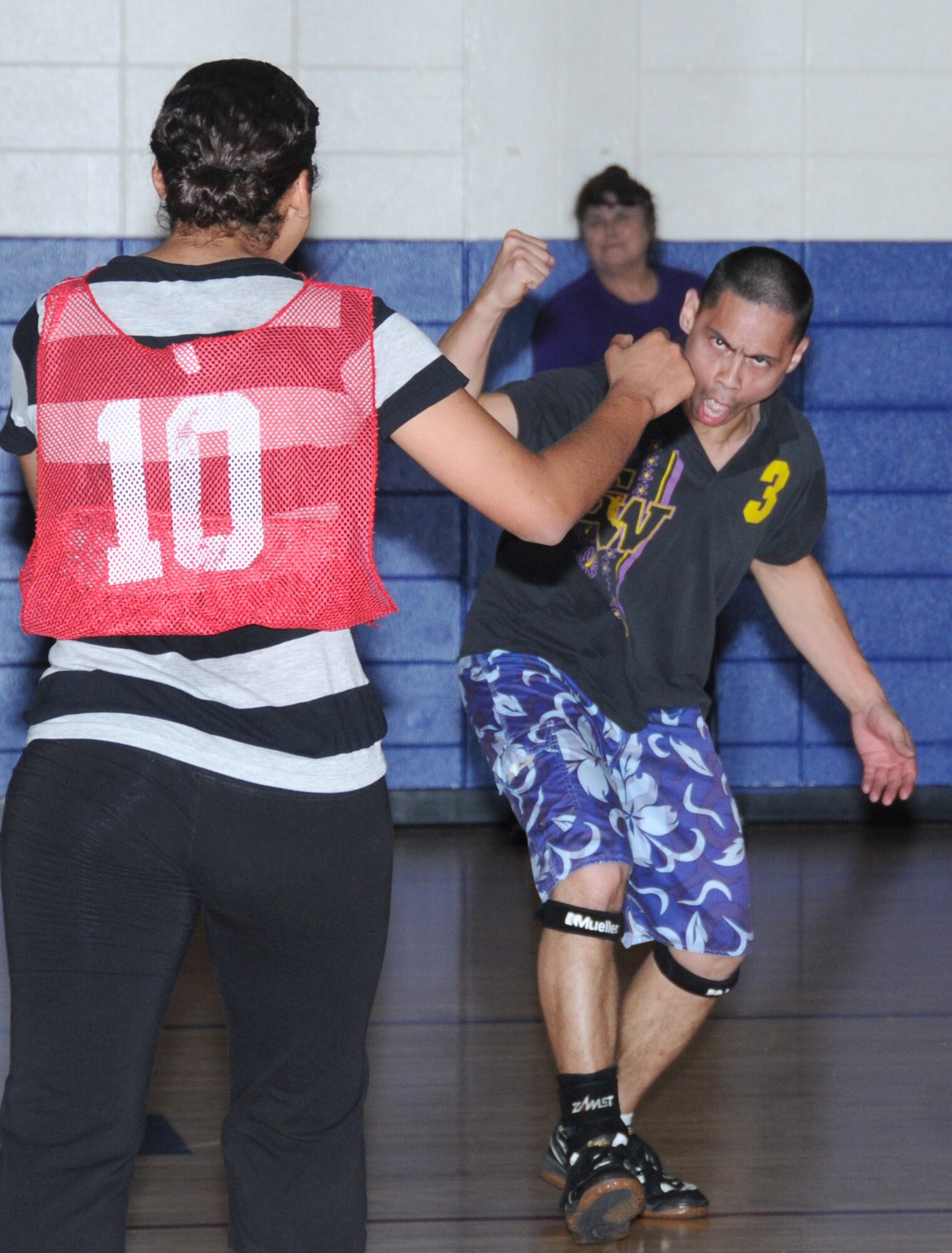 Dar-Rell Edwards, left, and Ronnie Iglesias, 81st MDTS, celebrate after winning the first match of the championship game.  (U.S. Air Force photo by Kemberly Groue)
