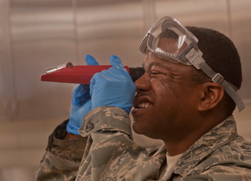 Tech. Sgt. Cameron Buckingham, 23rd Logistics Readiness Squadron fuels flight NCO in charge, zeroes out a refractometer at Moody Air Force Base, Ga., April 27. The refractometer is used to measure fuel system icing inhibitor content in Jet Fuel. (U.S. Air Force photo/Airman 1st Class Douglas Ellis)(RELEASED)

