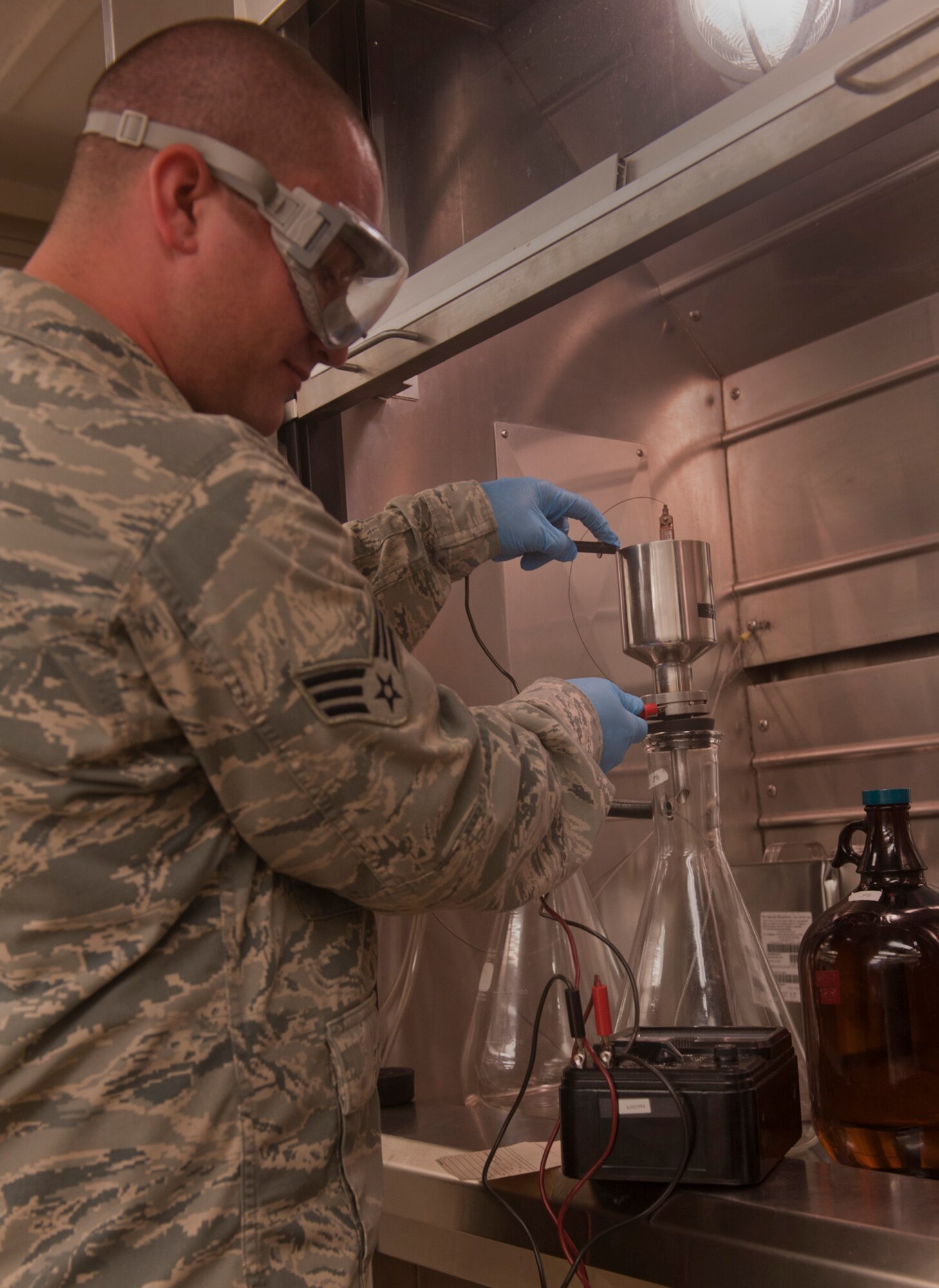 Senior Airman Bryan Jackson, 23rd Logistics Readiness Squadron fuels technician, takes a reading of the amount of ohms in a filtration apparatus before pouring JP-8 jet fuel into the filter at Moody Air Force Base, Ga., April 27. Airman Jackson checked the ohms to ensure there is no static electricity which could potentially ignite the fuel. (U.S. Air Force photo/Airman 1st Class Douglas Ellis)(RELEASED)
