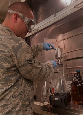 Senior Airman Bryan Jackson, 23rd Logistics Readiness Squadron fuels technician, takes a reading of the amount of ohms in a filtration apparatus before pouring JP-8 jet fuel into the filter at Moody Air Force Base, Ga., April 27. Airman Jackson checked the ohms to ensure there is no static electricity which could potentially ignite the fuel. (U.S. Air Force photo/Airman 1st Class Douglas Ellis)(RELEASED)
