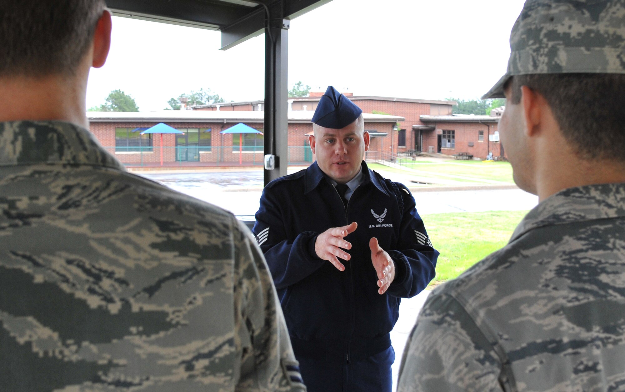 Staff Sgt. Cory Baker, a 714th Training Squadron military training leader, talks to a few of the non-prior enlisted aviators he mentors April 25, 2011, at Little Rock Air Force Base, Ark.  The Big Spring, Texas, native also maintains the squadron’s physical training program which averages more than a 91 percent pass rate.  (U.S. Air Force photo by Staff Sgt. Chris Willis)