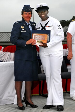 JOINT BASE CHARLESTON, S.C. (April 22, 2011) Electronics Technician 3rd Class Ashley Gray receives the enlisted honor man plaque, awarded to the highest grade-point-average for the enlisted class, from Col. Martha Meeker during the Navy Nuclear Power Training Command graduation ceremony for class 1101 at Joint Base Charleston-Weapons Station, April 22.  ET3 Gray earned an overall GPA of 3.90. Colonel Meeker is the Joint Base Charleston commander. (U.S. Navy photo/Machinist’s Mate 3rd Class Brannon Deugan)