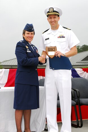 JOINT BASE CHARLESTON, S.C. (April 22, 2011) Lt. Gregory Dietzen receives the Vice Adm. Behrens award plaque, awarded to the graduating officer with the highest grade-point-average, from keynote speaker Col. Martha Meeker during the Navy Nuclear Power Training Command graduation ceremony for class 1101 at Joint Base Charleston-Weapons Station, April 22.  Lieutenant Dietzen earned an overall GPA of 3.91. Colonel Meeker is the Joint Base Charleston commander. (U.S. Navy photo/Machinist’s Mate 3rd Class Brannon Deugan)