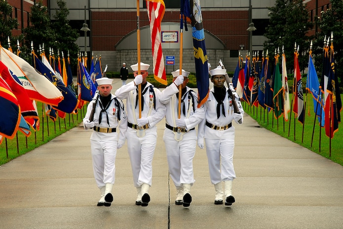 JOINT BASE CHARLESTON, S.C. (April 22, 2011) Left, Electronics Technician 3rd Class Richard Hinkle, Machinist’s Mate 3rd Class Eric Lucas, Electronics Technician 3rd Class Thomas Nickle and Electrician’s Mate 3rd Class Justin Joseph, the Navy Nuclear Power Training Command Color Guard, present Colors during the NNPTC graduation ceremony at Joint Base Charleston-Weapons Station, April 22.  The ceremony honored more than 400 Sailors graduating from NNPTC. (U.S. Navy photo/Machinist’s Mate 3rd Class Brannon Deugan)