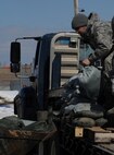 WARD COUNTY, N.D. -- A 91st Missile Wing Airman loads sandbags into
a Bobcat vehicle here April 13. The base is prepared to handle these types of events through robust readiness plans and are taking the appropriate steps to mitigate the effects of increased water levels. (U.S. Air Force photo/Airman 1st Class Aaron-Forrest Wainwright)
