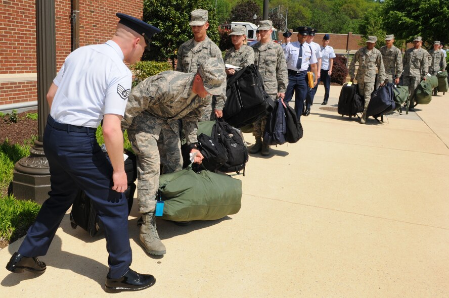Staff Sgt. Christopher Cenatiempo, training instructor with The U.S. Air Force Honor Guard, instructs Airman Chance Stone, Honor Guard Trainee April 25, at Joint Base Anacostia-Bolling, Washington, D.C. Airmen must move with haste and precision with all orders and activities during and after their eight-week technical training course. (U.S. Air Force photo by Senior Airman Christopher Ruano)