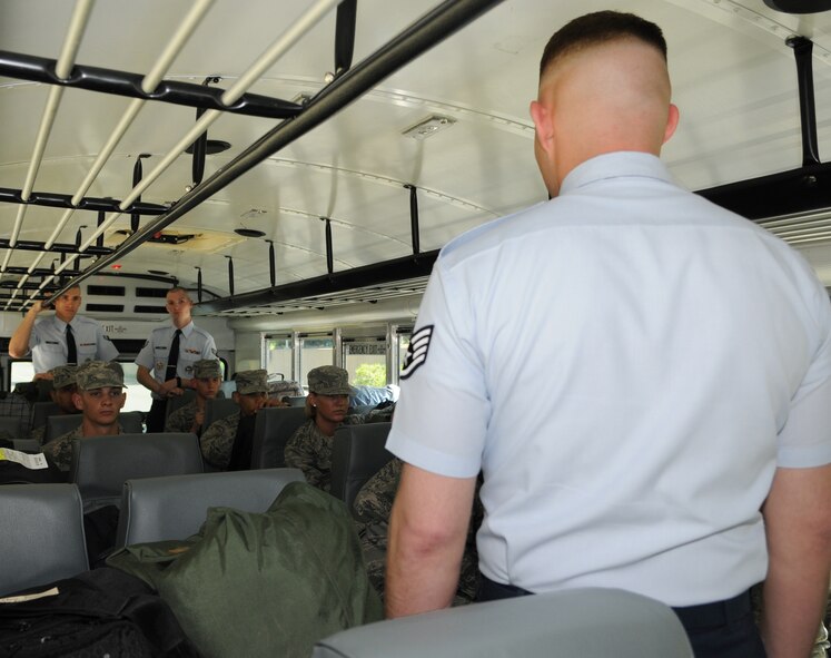 Staff Sgt. Christopher Cenatiempo, a training instructor with The U.S. Air Force Honor Guard tells the new Honor Guard trainees how his bus is run April 25, at Washington’s Ronald Reagan National Airport. This is just a taste of the rules and standards honor guard trainees must follow during their eight-week technical training school. (U.S. Air Force photo by Senior Airman Christopher Ruano)