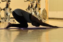 MINOT AIR FORCE BASE, N.D. -- Yoga class-taker Ashley Stephenson performs a pose during a yoga class taught at the McAdoo Sports and Fitness Center here. Yoga offers many different benefits, including improved muscle tone, relaxation and greater flexibility. (Air Force photo/ Airman 1st Class Jessica McConnell)