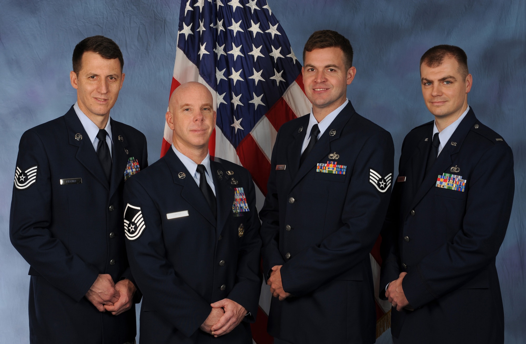 Members of the Oregon Air National Guard's 123rd Weather Flight were recently recognized with the U.S. Air Force's Outstanding Technical Achievement in Weather Operations Award. From left to right are: Tech. Sgt. Michael Fischer, Master Sgt. Ken Campbell, Staff Sgt. Matt Jenkins, and Lt. Mark Gibson. The four Airmen volunteered for a six-month duty in Haiti following the devastating earthquake there, in January, 2010.  (U.S. Air Force photograph by Tech. Sgt. John Hughel, 142nd Fighter Wing Public Affairs).