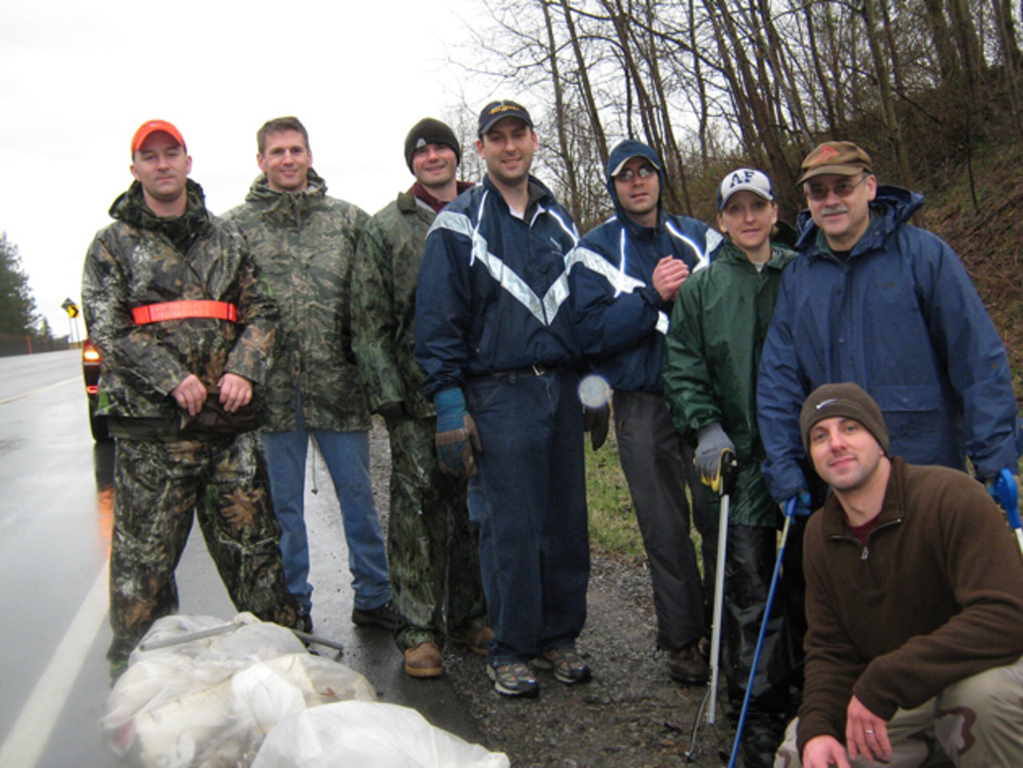 Ten Air National Guardsmen from the Eastern Air Defense Sector ignored the rain last Saturday and cleaned a local highway in support of the Clean and Green initiative. The group collected 38 garbage bags of trash and 10 junk tires. Pictured from left to right, are Technical Sgt. Rob Kryczkowski, Airman 1st Class Billy Young,  Staff Sgt. Shane Hastings, Staff Sgt. Derek Miceli, Staff Sgt. Eric Lewis, Airman 1st Class Marie Coar, Technical Sgt. John Coar and Staff Sgt. Tom Caracane. Not pictured were Staff Sgt. Jean Warner and Airman 1st Class Kaytlin Jones. 