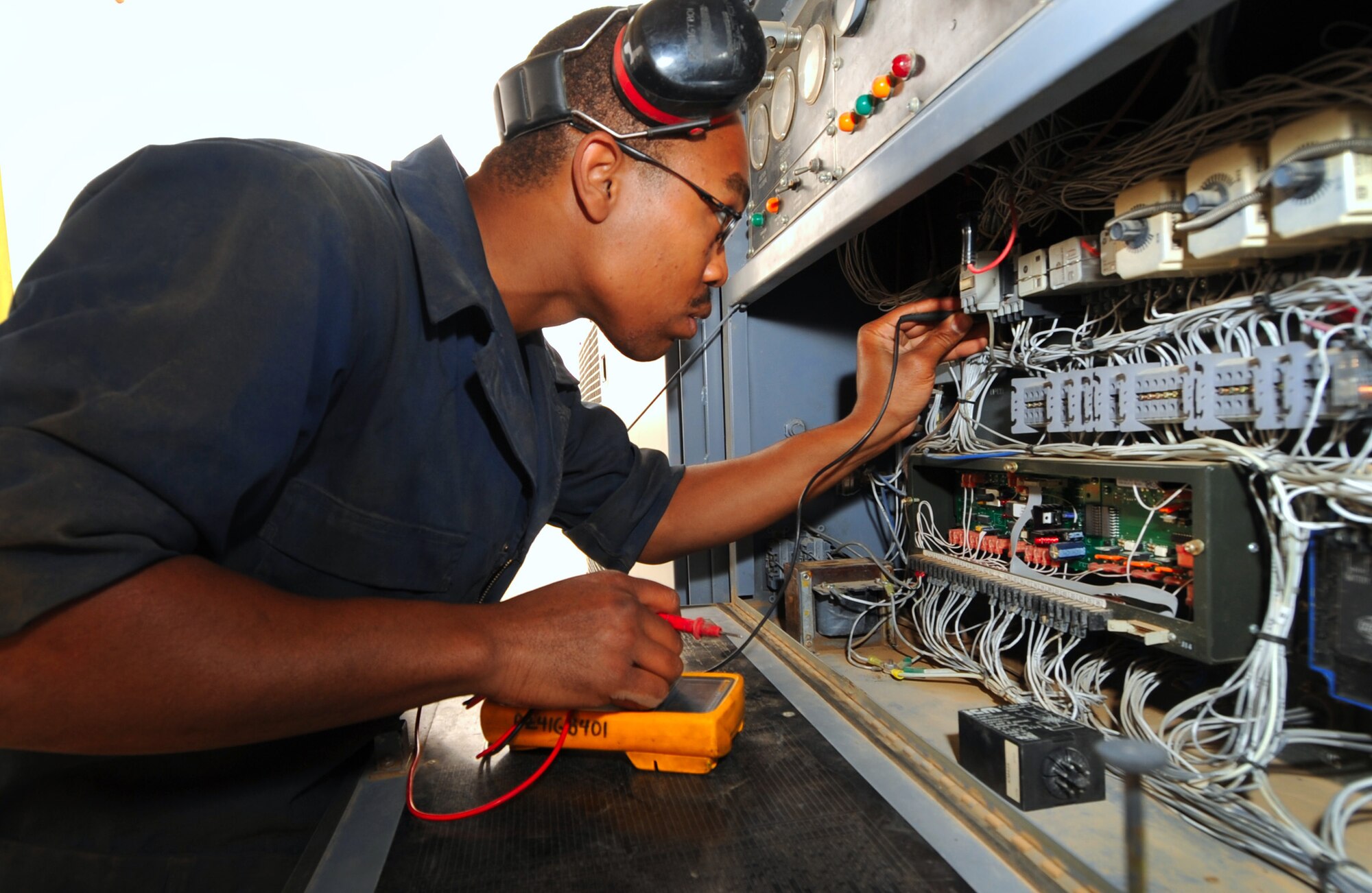 Staff Sgt. Steven Jackson checks the electrical continuity on a generator using a multimeter. Sergeant Jackson is with the 386th Expeditionary Maintenance Squadron. (U.S. Air Force photo by Senior Airman Cynthia Spalding)