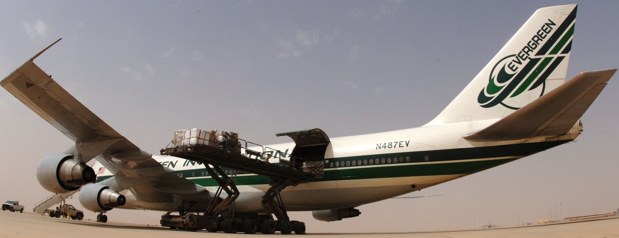 Airmen assigned to the 532nd Expeditionary Operations Support Squadron Air Mobility Flight offload cargo from a commercial 747 onto a 60K cargo loader April 20, 2011, at Al Asad Air Base, Iraq. The flight recently took on a commercial cargo mission and made history by unloading its first 747 earlier this month. Since then the aerial porters have offloaded three more 747s, which can hold up to 42 pallets each. (U.S. Air Force photo by Staff Sgt. R. Michael Longoria/Released)