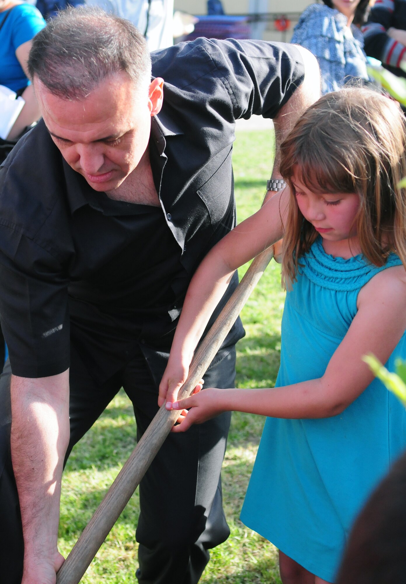 Col. Deniz Kartepe, the commander of the 10th Tanker Command, helps Bailey Matsumura plant a tree for National Sovereignty and Children?s Day during a Children?s Day festival April 17, 2011, at Incirlik Air Base, Turkey. The event was hosted by the Turkish air force 10th Tanker Command and was open to all Incirlik personnel. The event offered an opportunity for camaraderie and partnership-building for all personnel here, and was a chance to celebrate both Turkish children on their national holiday and military children during the Month of the Military Child, officials said.  (U.S. Air Force photo by 1st Lt Gina McKeen/Released)