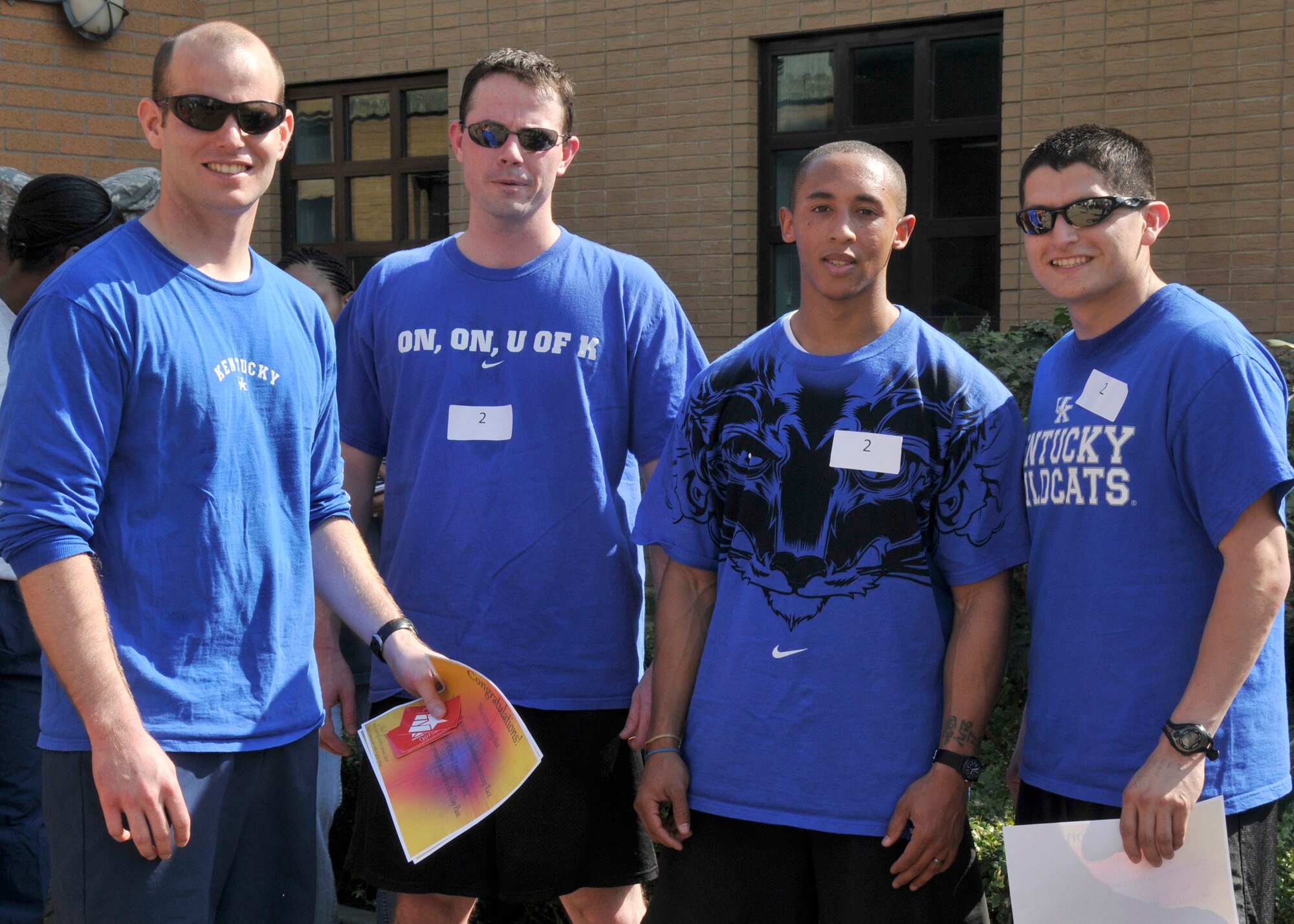 ROYAL AIR FORCE LAKENHEATH, England - (left to right) Capt. Troy Kenning, Airman 1st Class Garrett Silva, Staff Sgt. Keaston Simmons and Staff Sgt. Christopher Davalos of the 48th Contracting Squadron finished the Sexual Assault Awareness Month Amazing Race in first place on April 22, 2011. Nine teams of four were given SAAM related questions, various challenges and clues to follow to each location spanning from the fitness center to Defender Park. The top four teams received guest cards for a free meal at any Army and Air Force Exchange Service fast food restaurant and the first place team also received a one-day pass from Col. William Lewis, 48th Fighter Wing vice commander. (U.S. Air Force photo/Senior Airman Tiffany M. Deuel)