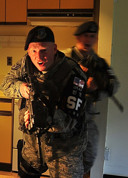 The Air Force Office of Special Investigations held an annual Crime Scene Investigation/ Active shooter exercise, here, April 27.   The scene was prepared with sheep’s blood and a moulaged dummy victim.   A husband returning from deployment, has Post Traumatic Stress Disease, kills his wife and abducts his child fleeing the dead wife scene.  The neighbor hears the shots and phones 911.   At the simulated residence, Bldg 930, Security Forces cleared the residence and OSI processed the scene gathering evidence.  The suspect killed his child and an active shooter incident took place.  This exercise helped field agents sharpen their CSI skills. (U.S. Air Force Photo by Staff Sgt. Daylena Gonzalez)