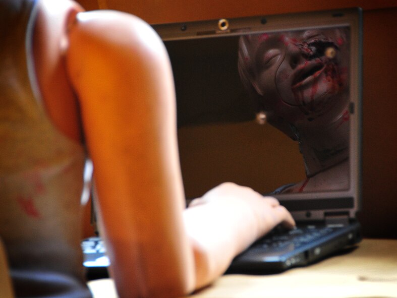 The Air Force Office of Special Investigations held an annual Crime Scene Investigation/ Active shooter exercise, here, April 27.   The scene was prepared with sheep’s blood and a moulaged dummy victim.   A husband returning from deployment, has Post Traumatic Stress Disease, kills his wife and abducts his child fleeing the dead wife scene.  The neighbor hears the shots and phones 911.   At the simulated residence, Bldg 930, Security Forces cleared the residence and OSI processed the scene gathering evidence.  The suspect killed his child and an active shooter incident took place.  This exercise helped field agents sharpen their CSI skills. (U.S. Air Force Photo by Staff Sgt. Daylena Gonzalez)