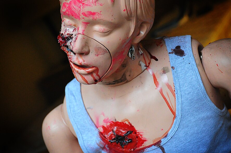 The Air Force Office of Special Investigations held an annual Crime Scene Investigation/ Active shooter exercise, here, April 27.   The scene was prepared with sheep’s blood and a moulaged dummy victim.   A husband returning from deployment, has Post Traumatic Stress Disease, kills his wife and abducts his child fleeing the dead wife scene.  The neighbor hears the shots and phones 911.   At the simulated residence, Bldg 930, Security Forces cleared the residence and OSI processed the scene gathering evidence.  The suspect killed his child and an active shooter incident took place.  This exercise helped field agents sharpen their CSI skills. (U.S. Air Force Photo by Staff Sgt. Daylena Gonzalez)